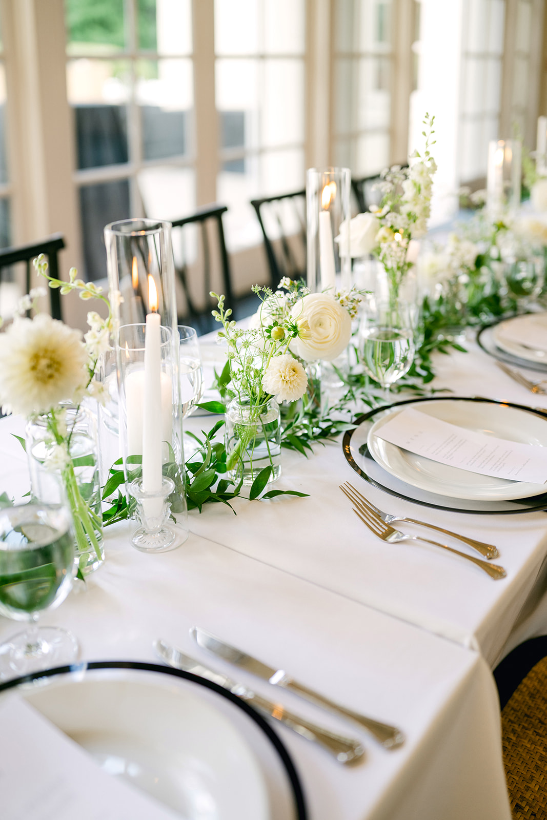 Candles and bud vases for low height wedding table decor