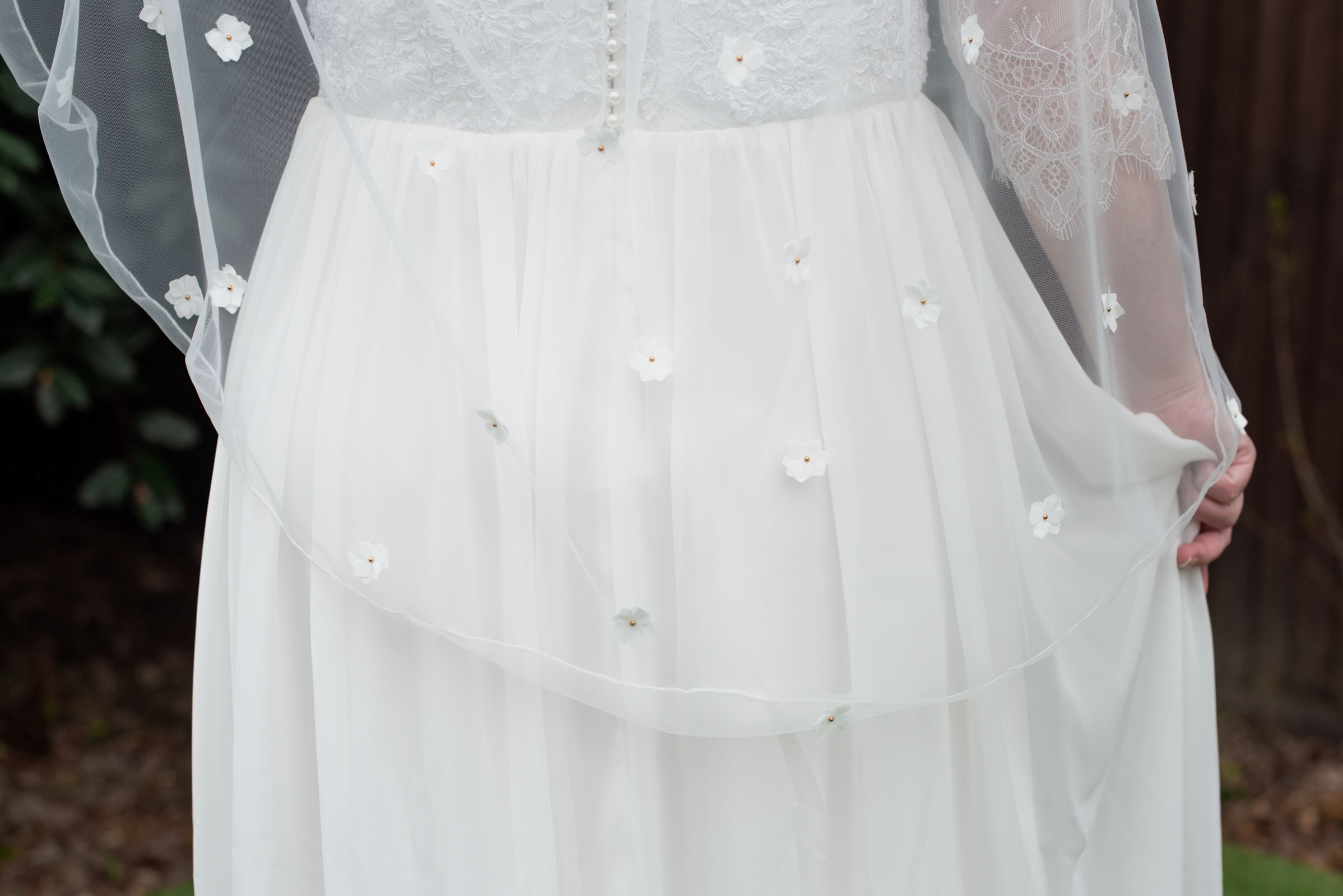 Fingertip length bridal veil with 3D flowers