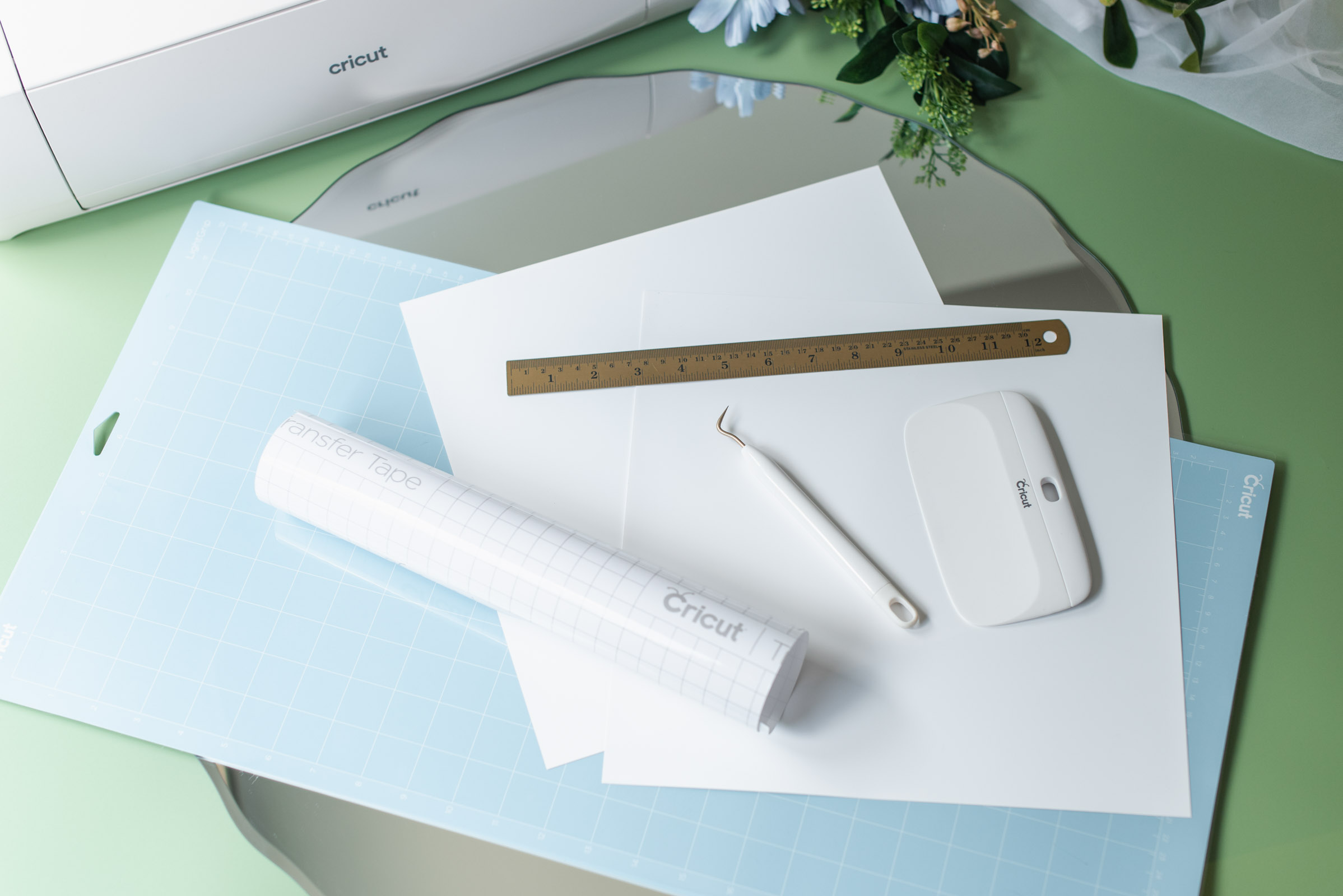 Materials and tools needed to make a wedding welcome mirror sign with a Cricut