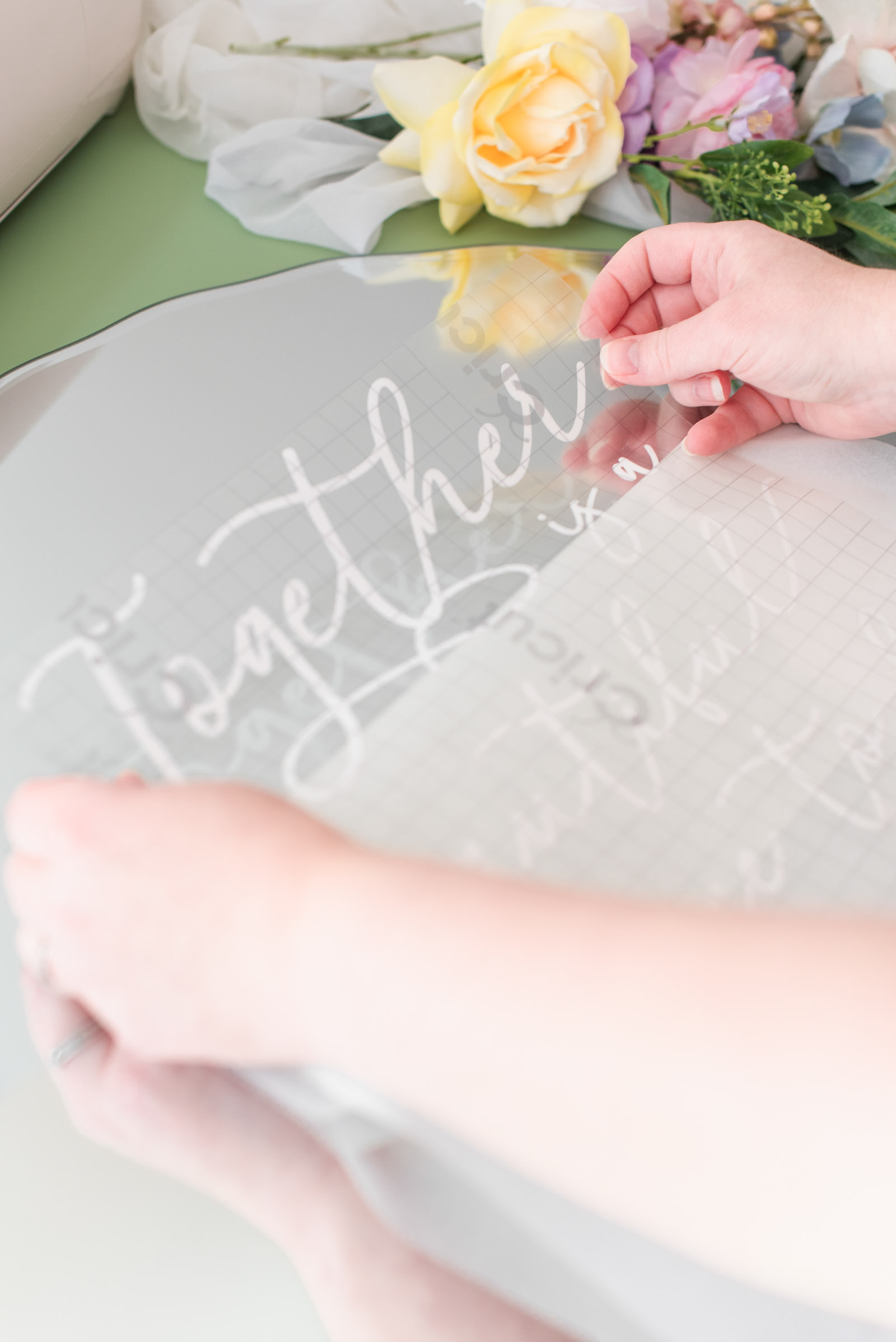 Step by step tutorial on how to transform a mirror into a wedding welcome sign with a Cricut machine from the Cricut Weddings book by Chelsea Barton
