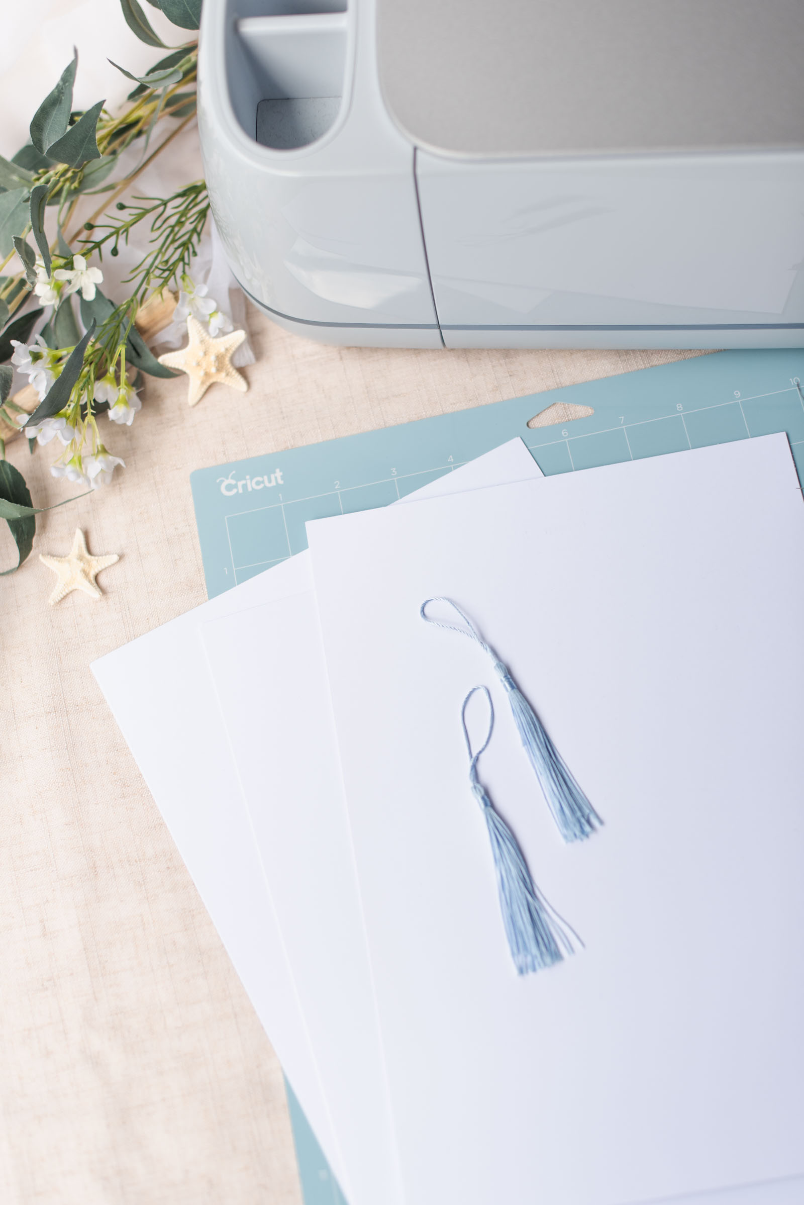 Supplies needed for an easy DIY double sided wedding program fan made with a Cricut