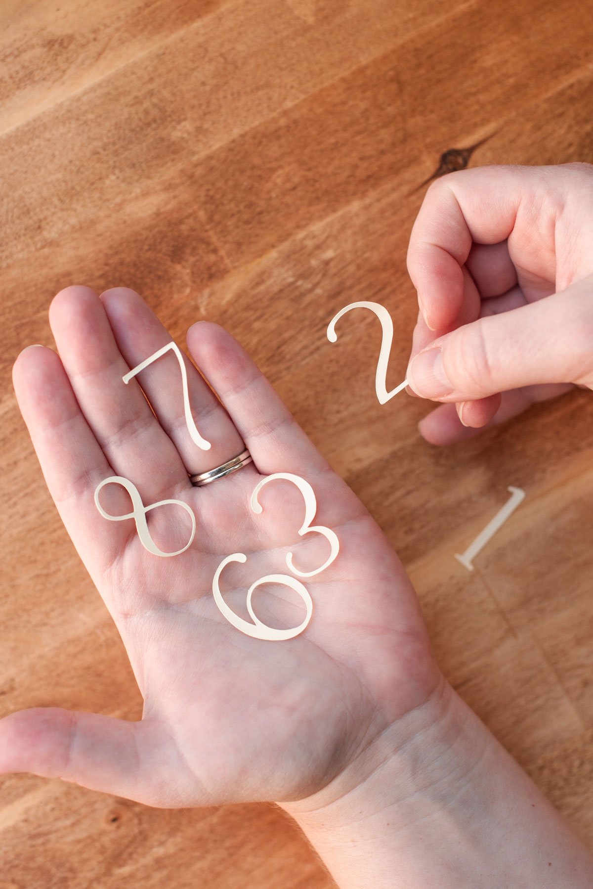Easy Cricut wedding table number luminaries made with paper cardstock and vellum
