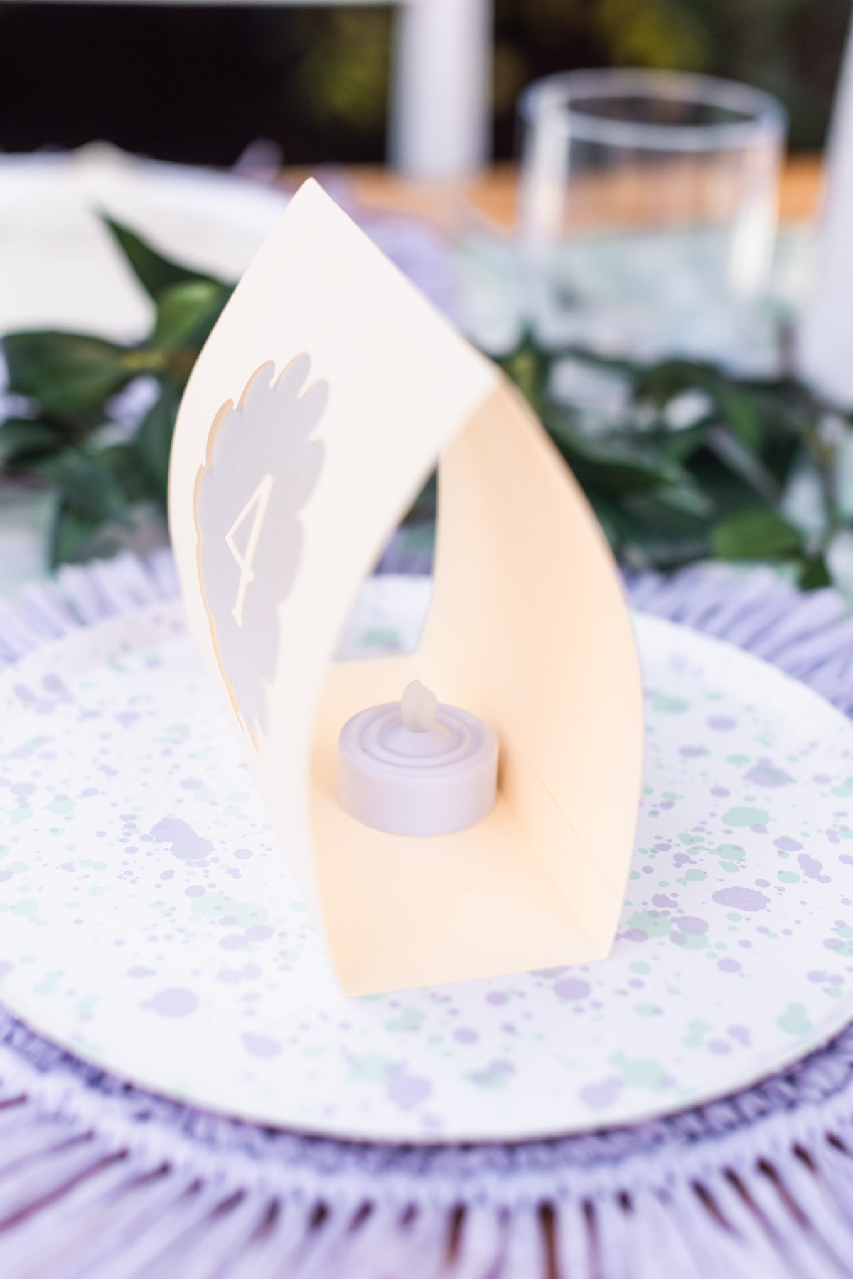 Easy Cricut wedding table number luminaries made with paper cardstock and vellum