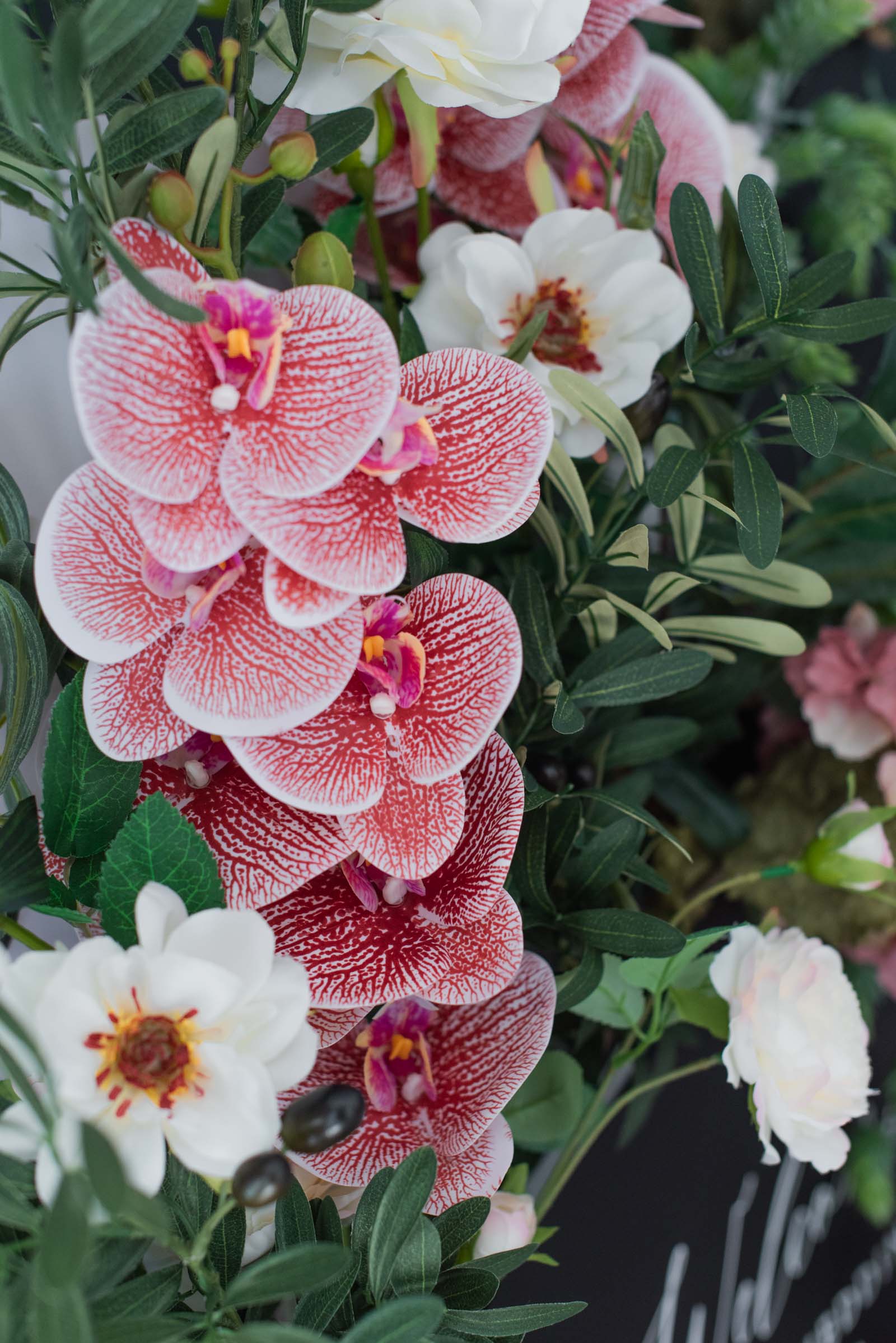 Faux orchids and hydrangeas for a unique autumnal wedding flower box sign decor