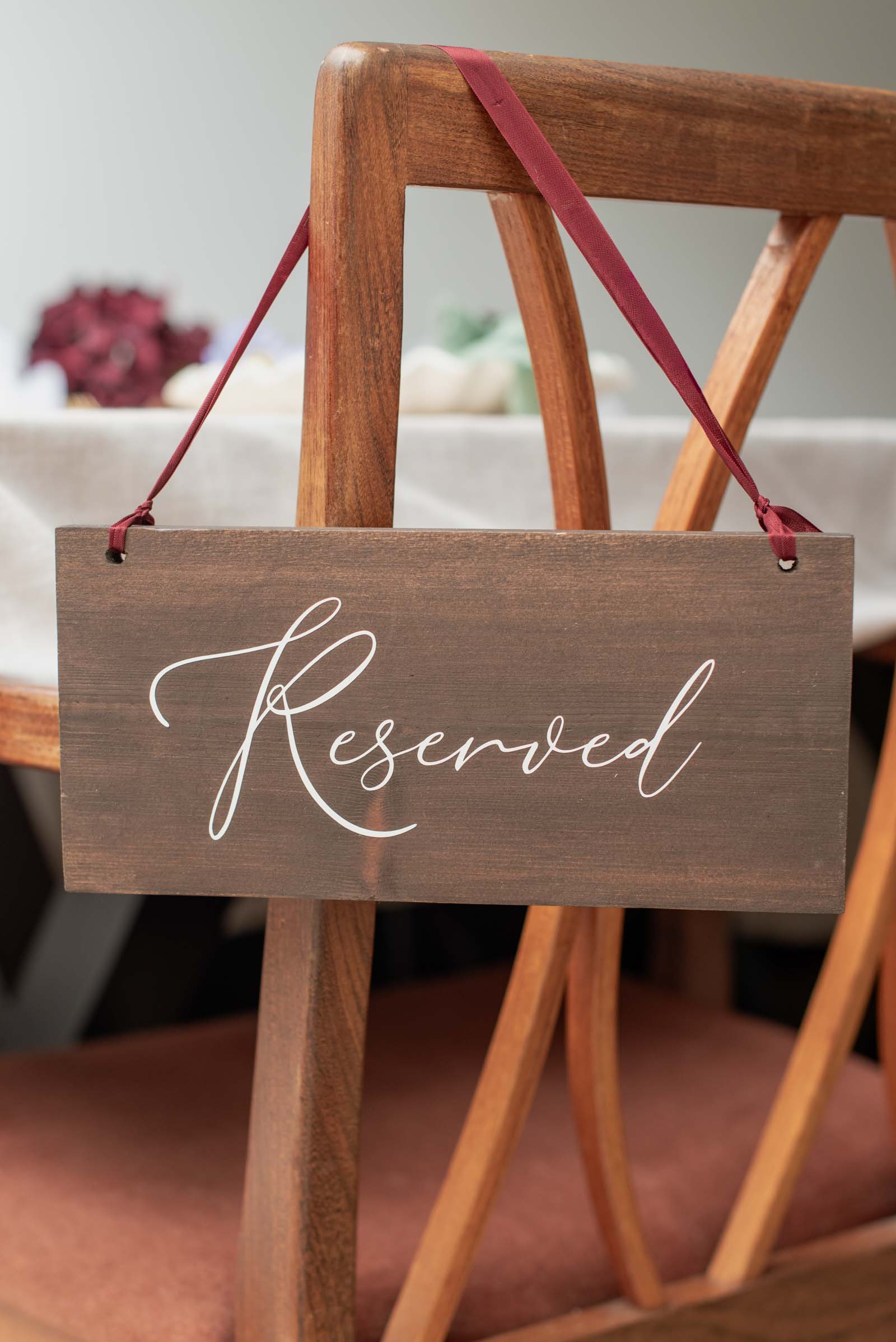 Dark oak hanging wood wedding Reserved sign with burgundy red ribbon