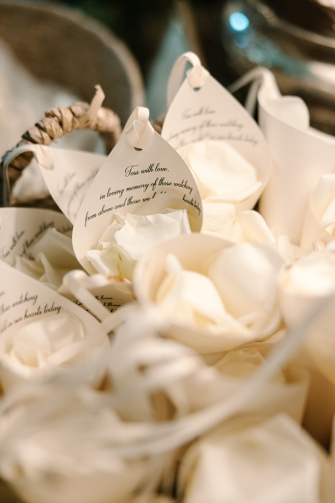 DIY confetti cones with white rose petals and message for in loving memories