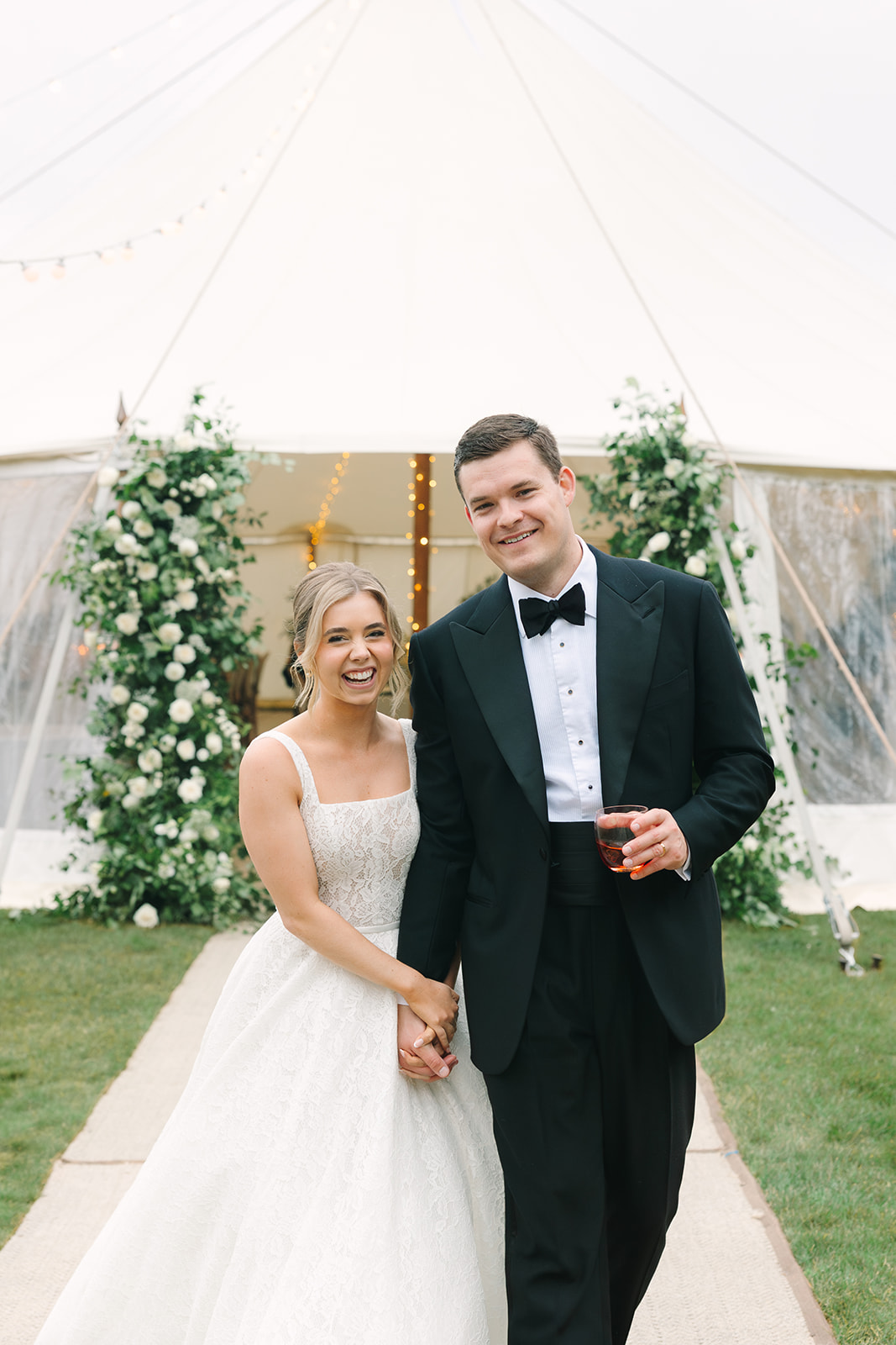 Bride and groom outside their wedding tent marquee at Findon Place in England
