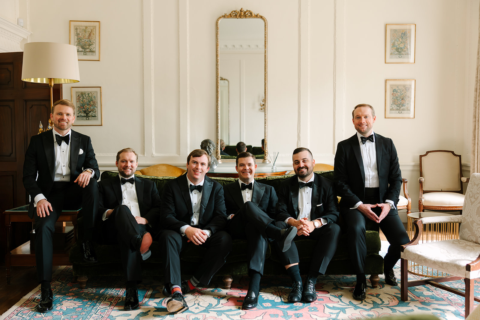 Groom and groomsmen wearing classic tuxedos at Findon Place