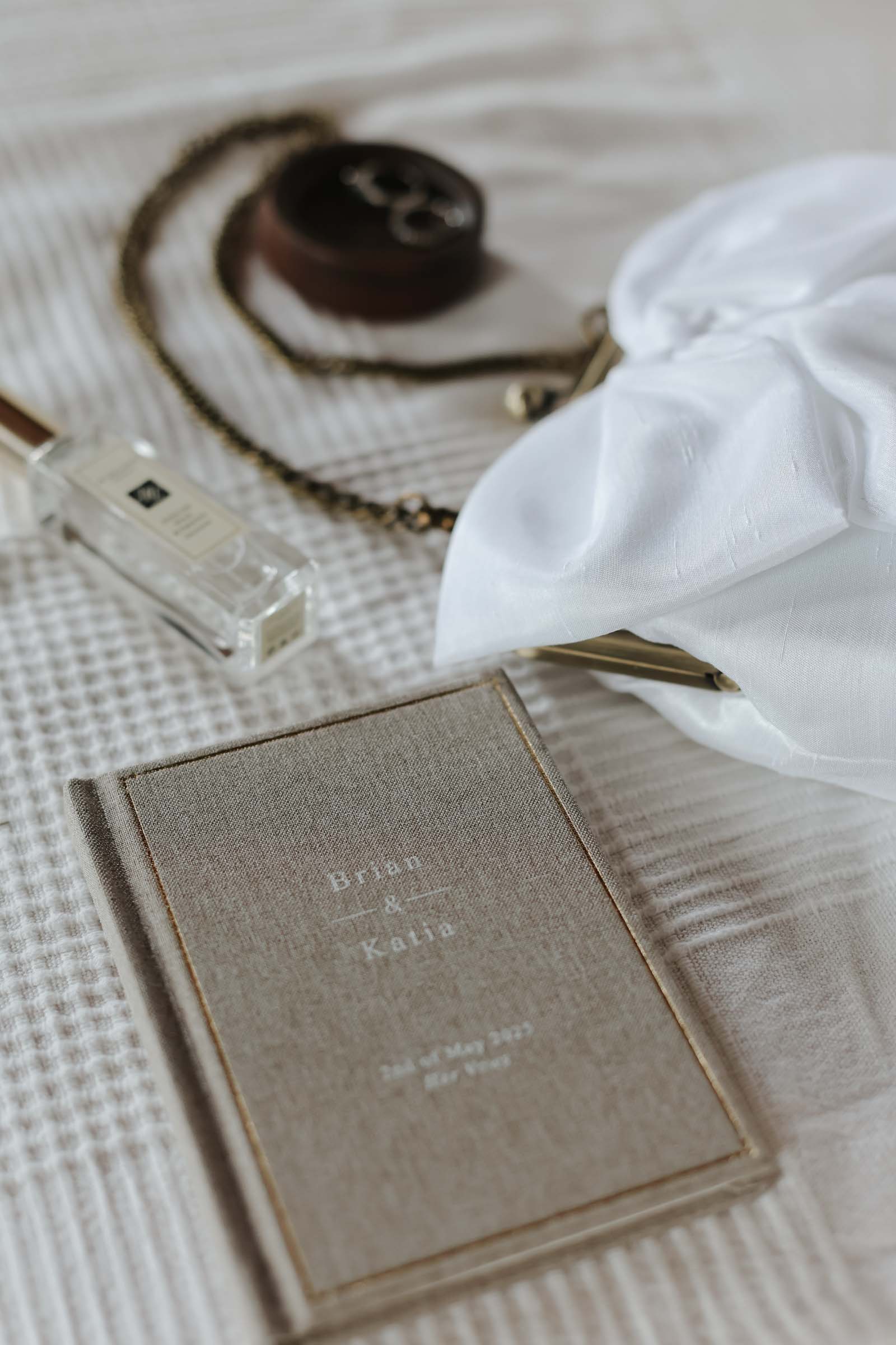 A customized linen vow book for a bride and groom