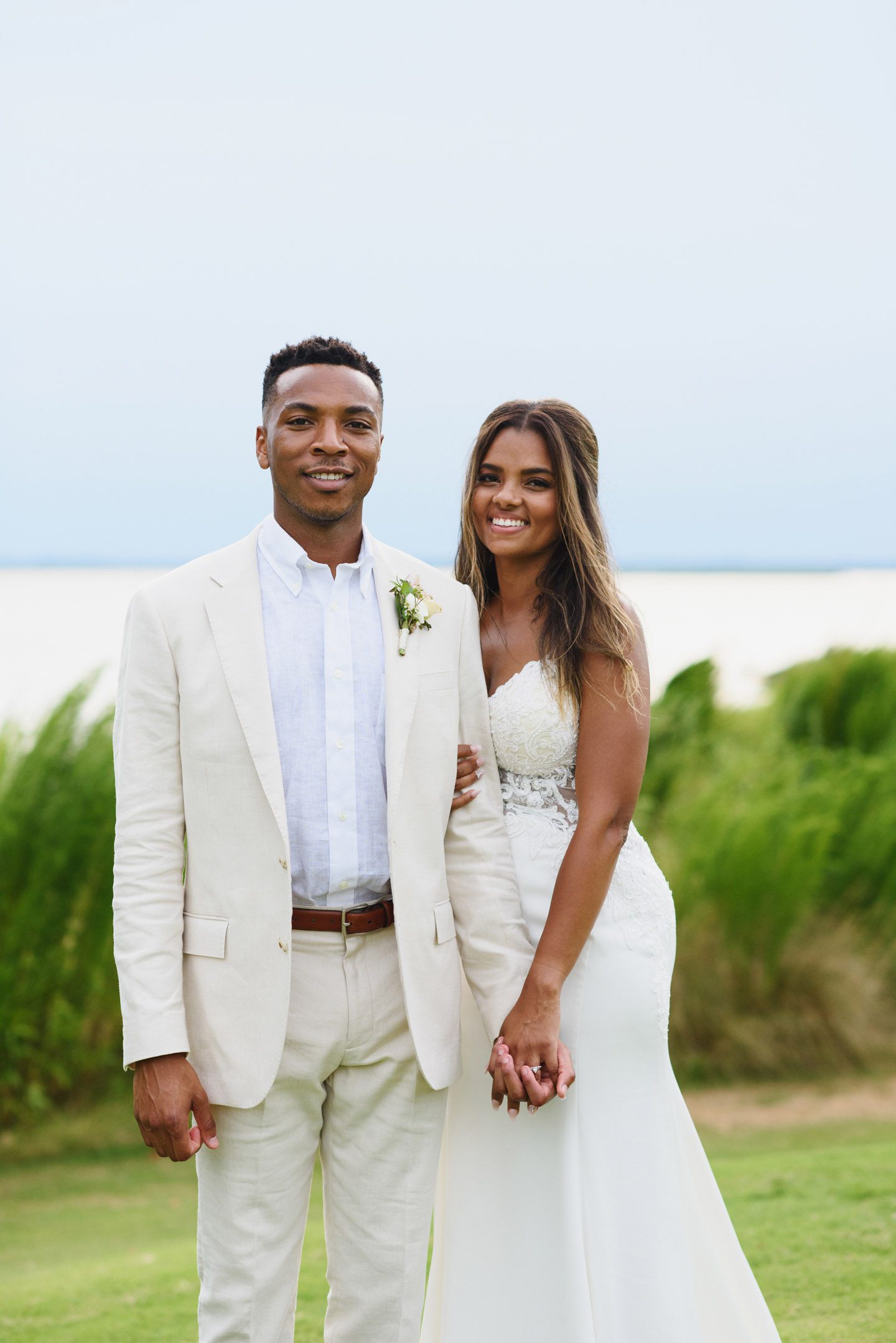 Sunset coral monochromatic bridal look on medium brown skin