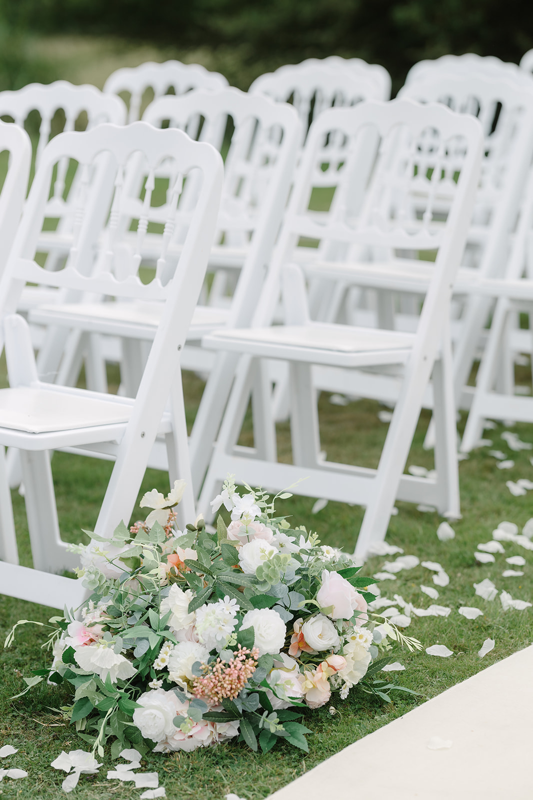 Rented aisle decor from The Floral Hire in England