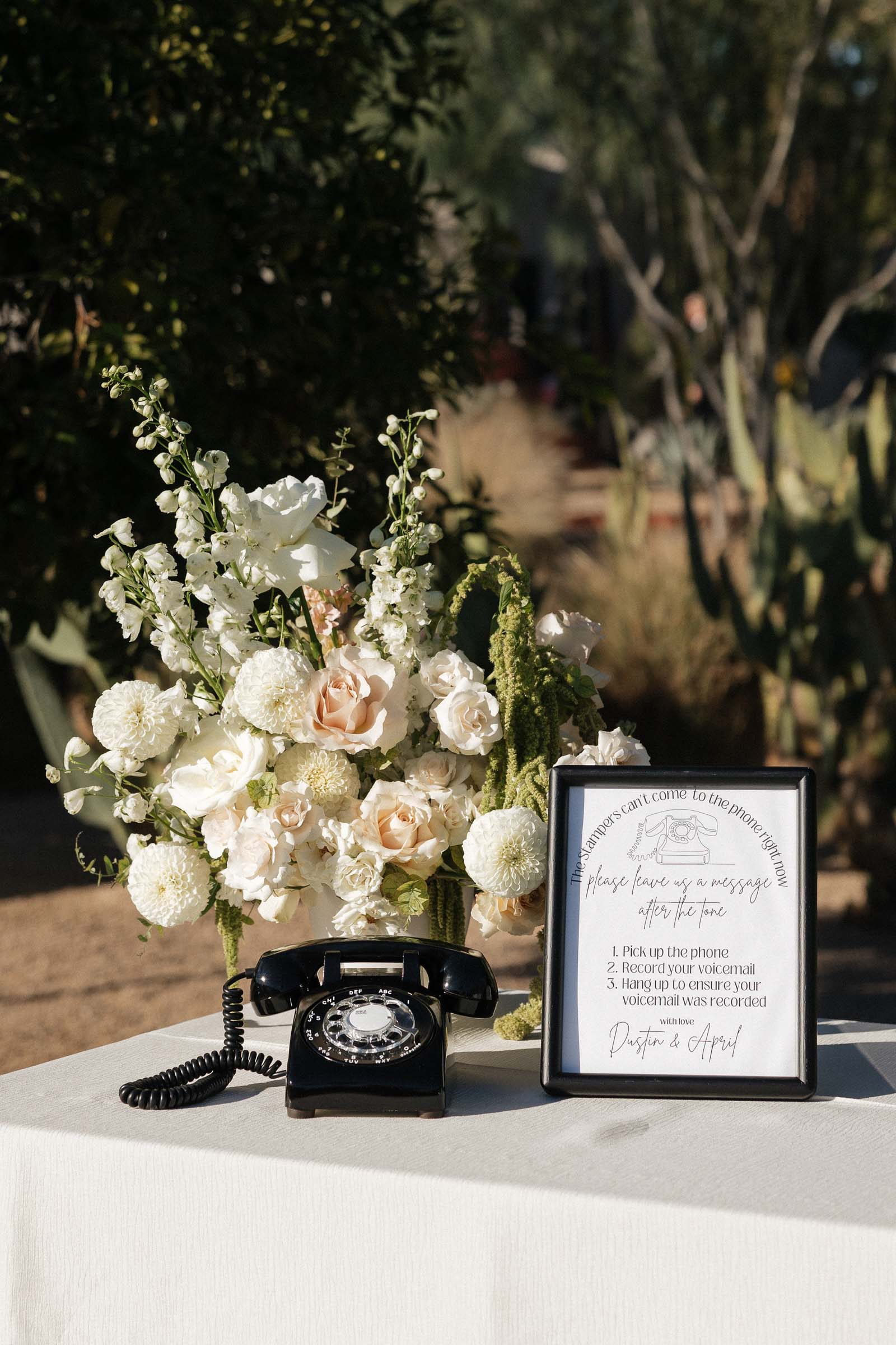 Modern black retro rotary phone for a wedding audio guestbook setup