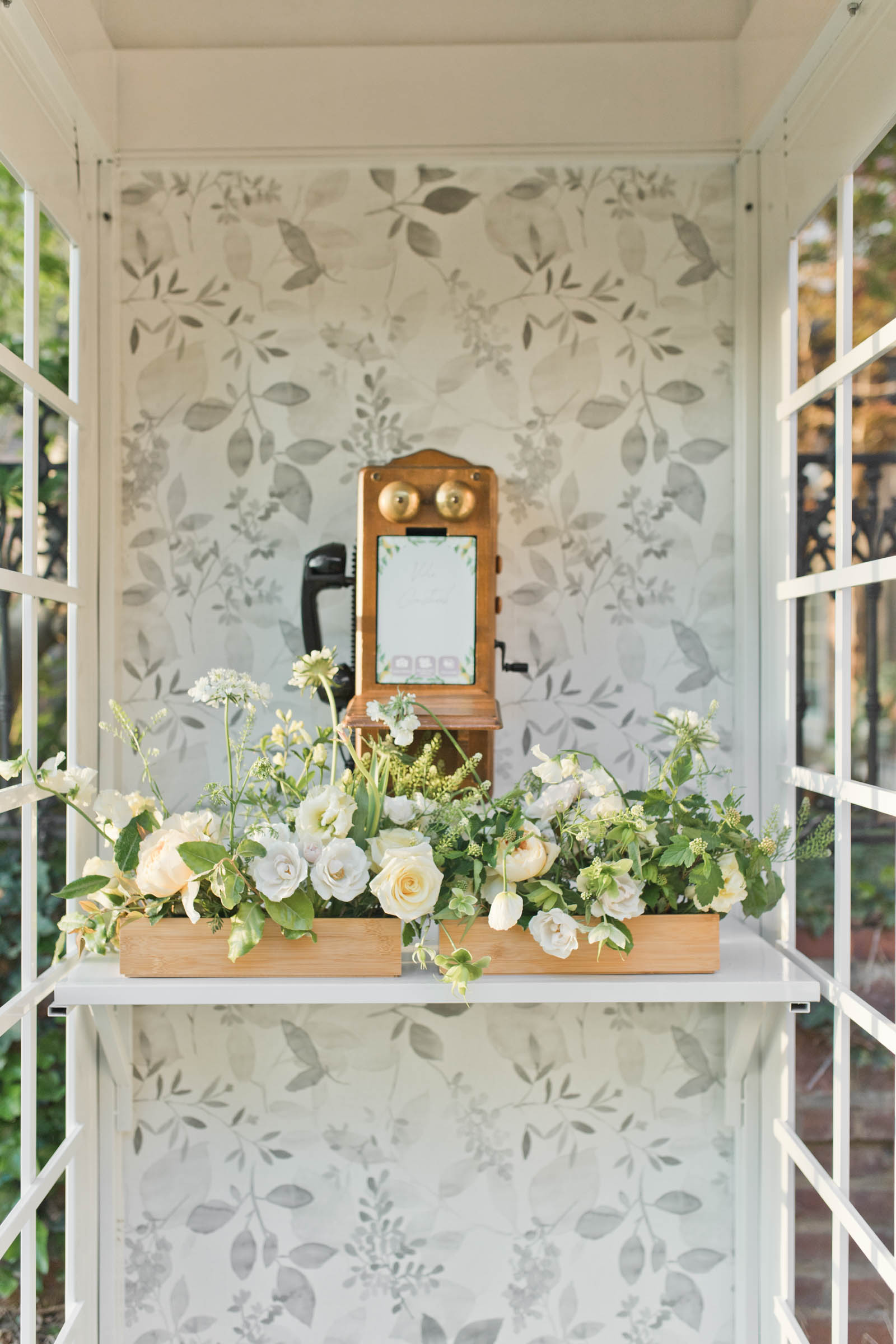 White British phone box with vintage phone inside for a nostalgic wedding audio guestbook setup