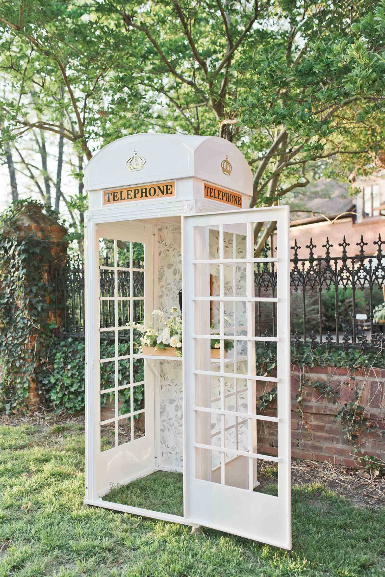 White British phone box with vintage phone inside for a nostalgic wedding audio guestbook setup