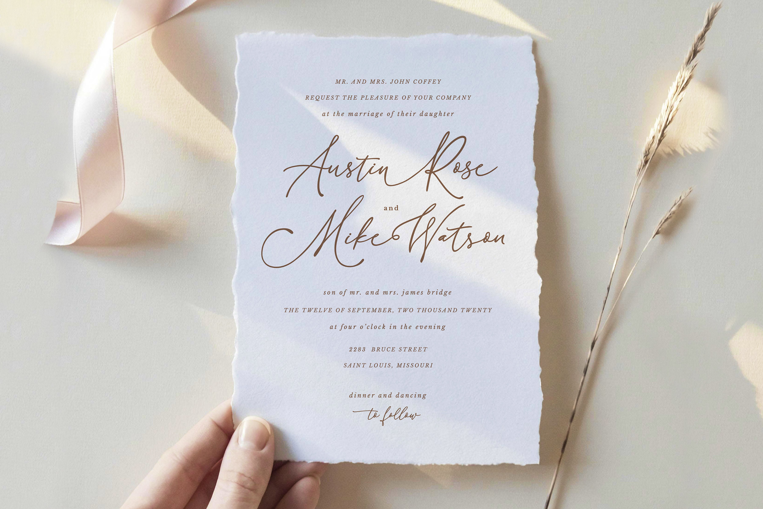 Blush pink wedding invitation with elegant script font from Creative Fabrica, paired with gold wax seal and soft floral accents