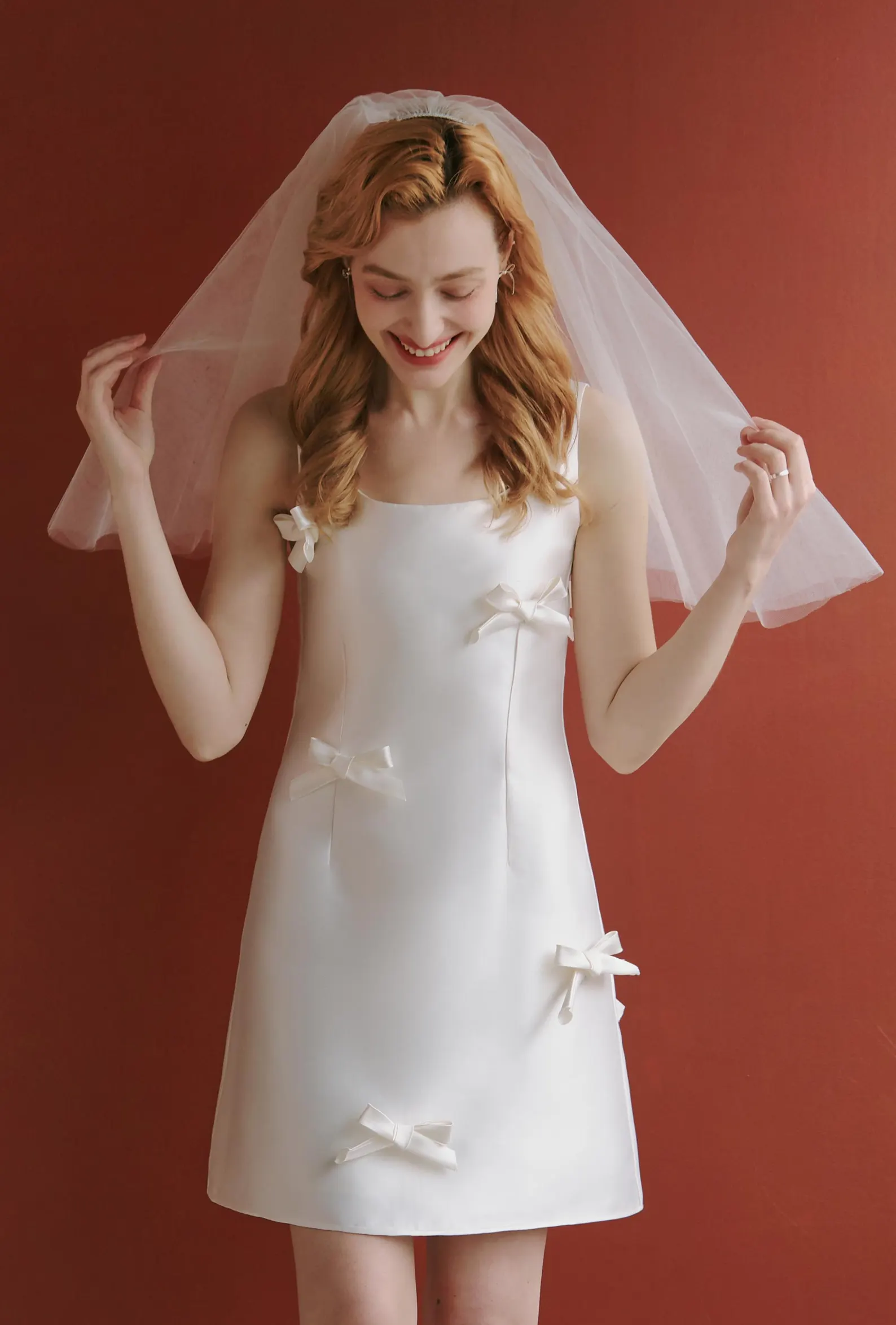 White mikado satin mini wedding dress with tiny bows