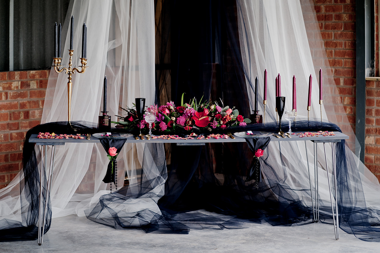 Black and grey tulle wedding draping for reception decor with pink Anthurium flower centerpiece