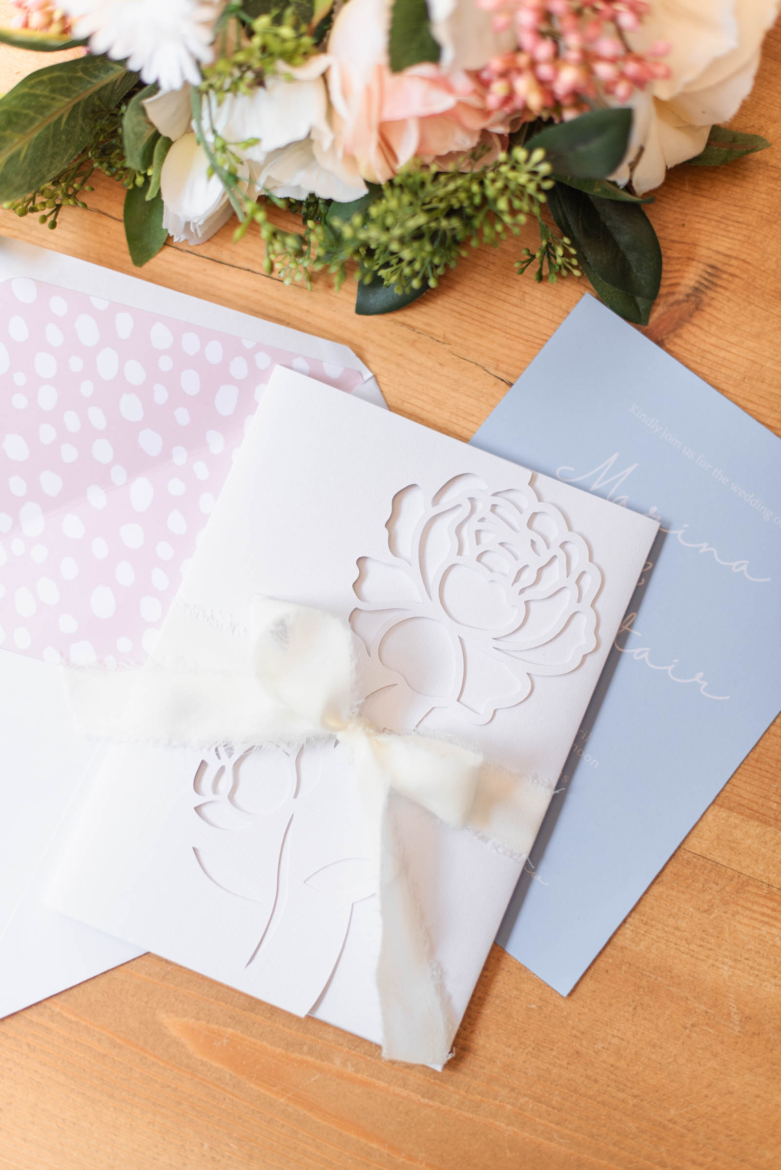 Intricate cut peony invitation jacket from the Cricut Weddings book