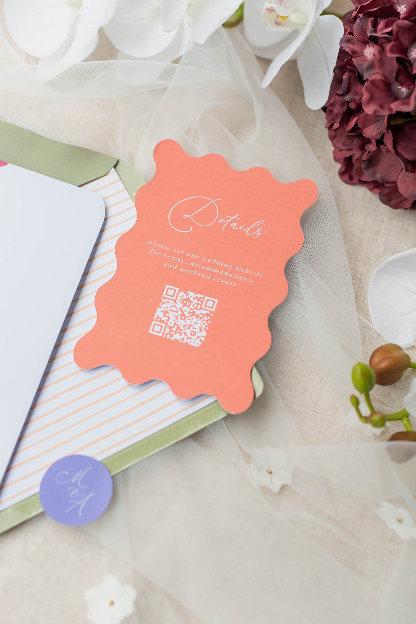 Wavy shaped orange coral wedding invitation details card with QR code