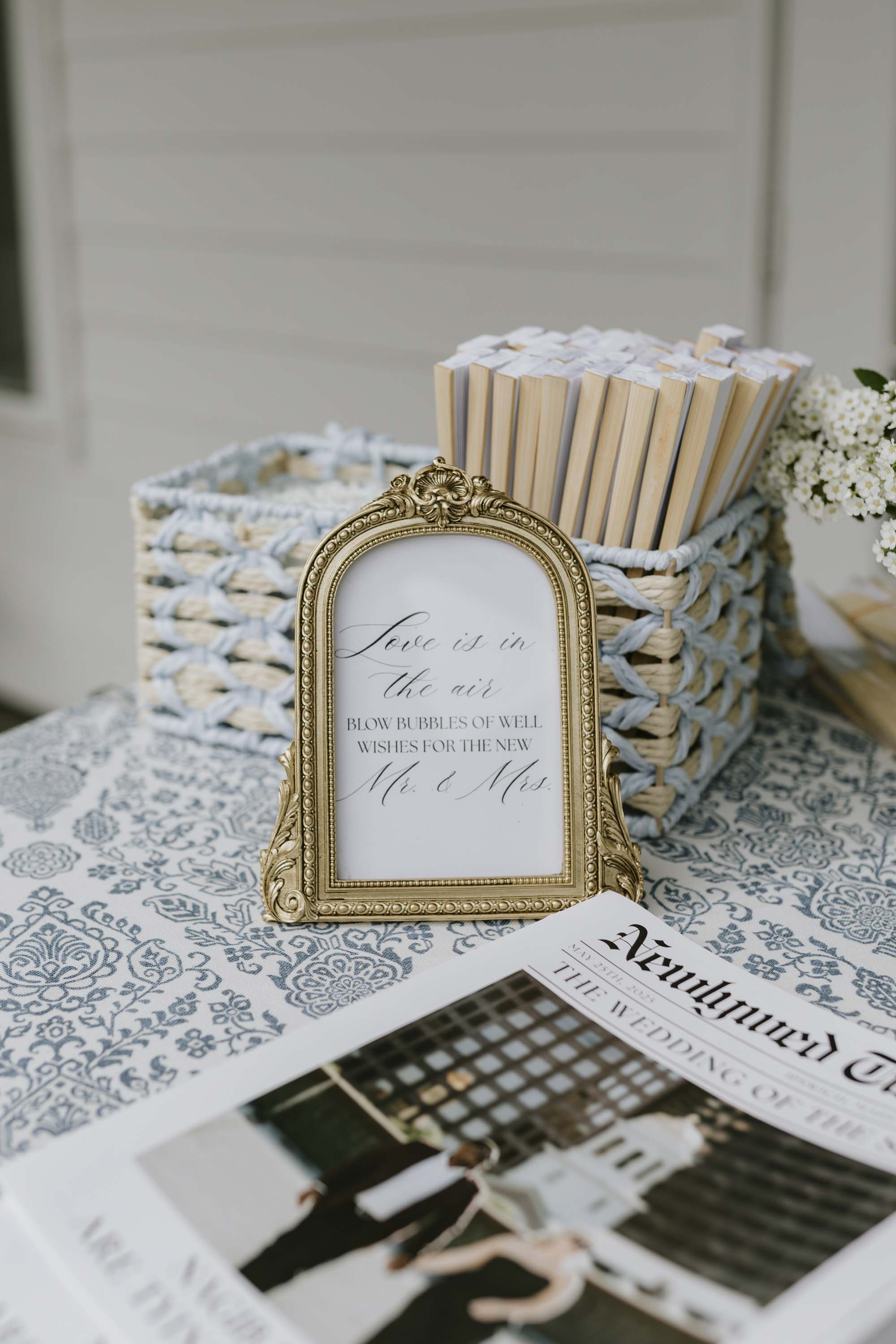 Ceremony bubbles with DIY wedding sign