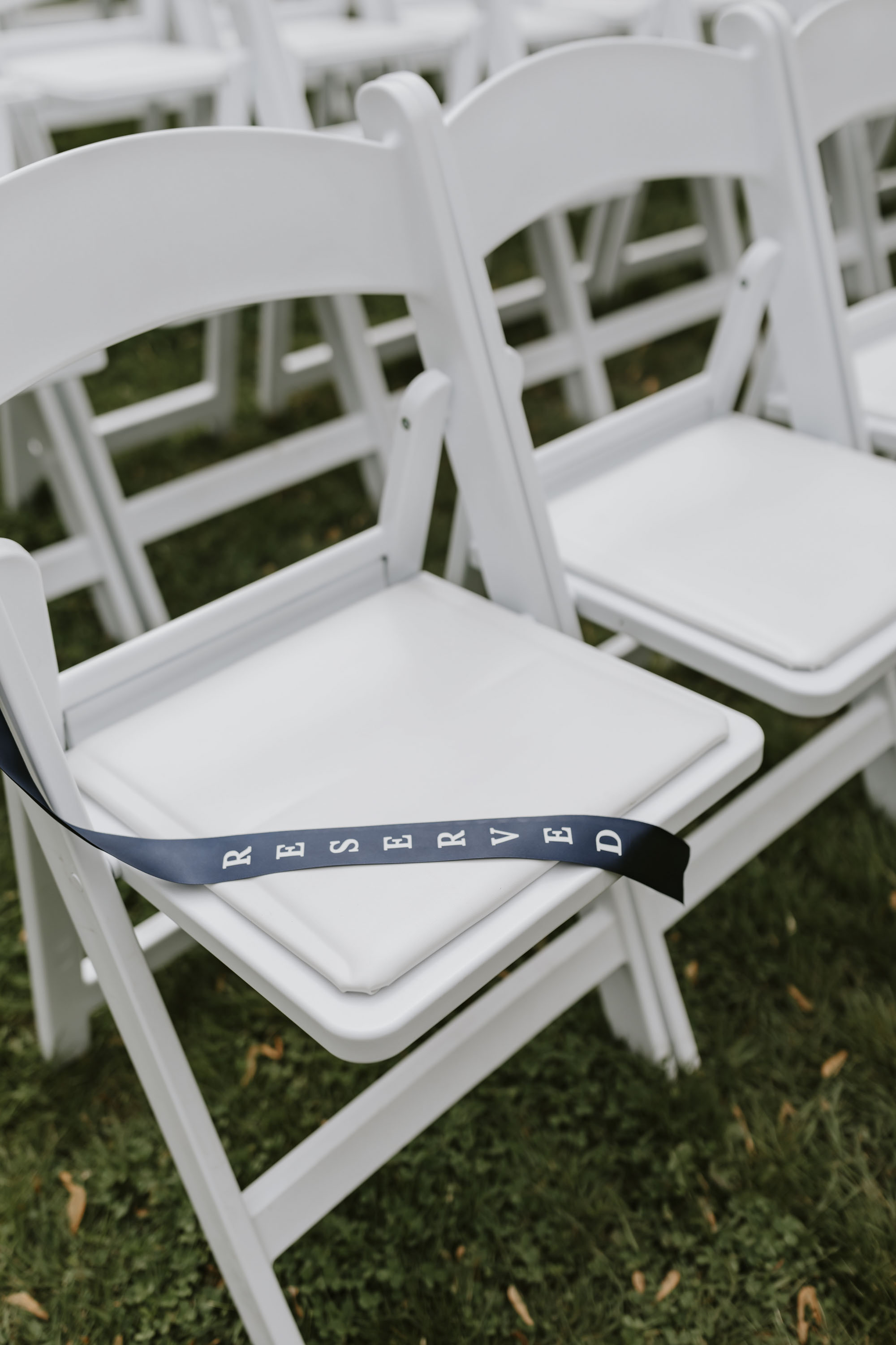 DIY Reserved navy blue and white chair ribbon made with a Cricut machine