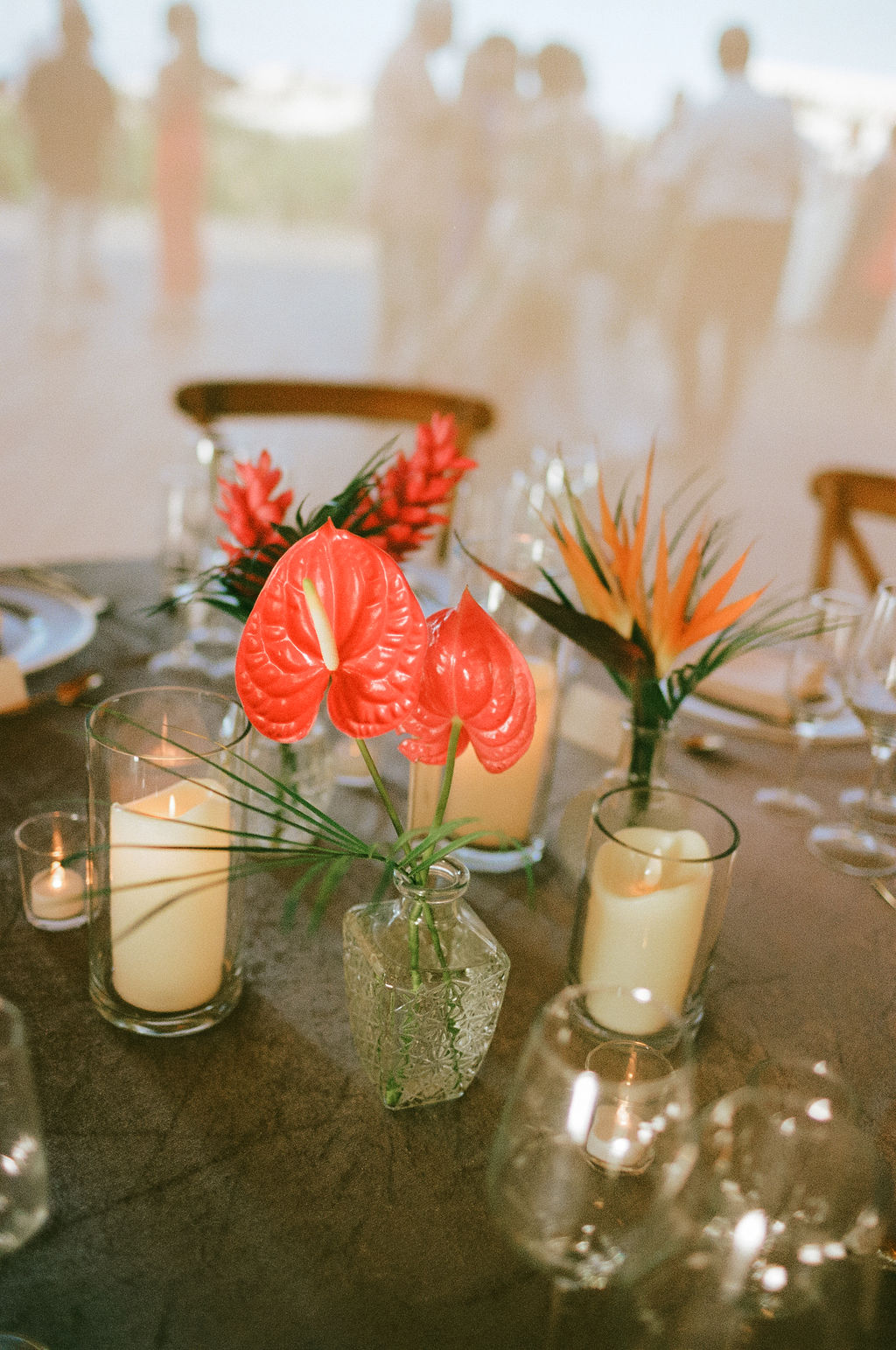 Small tropical themed wedding floral centerpieces and table decor
