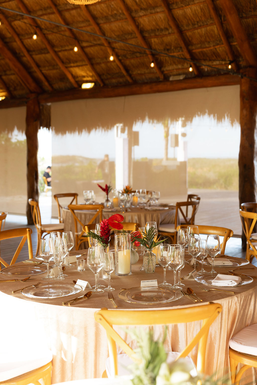 Small tropical themed wedding floral centerpieces and table decor