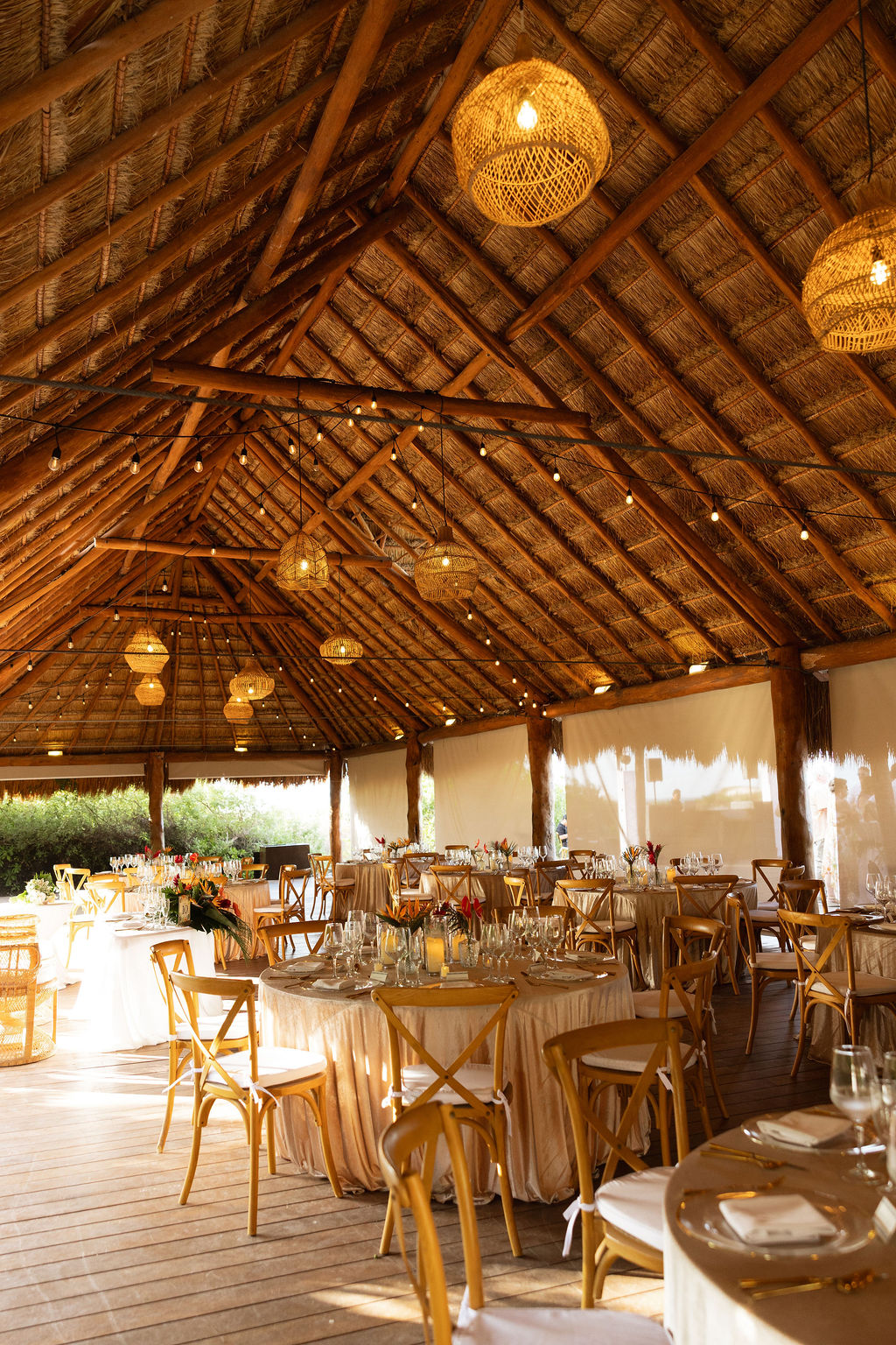 Thatched roof palapa at Finest Playa Mujeres for boho tropical wedding reception