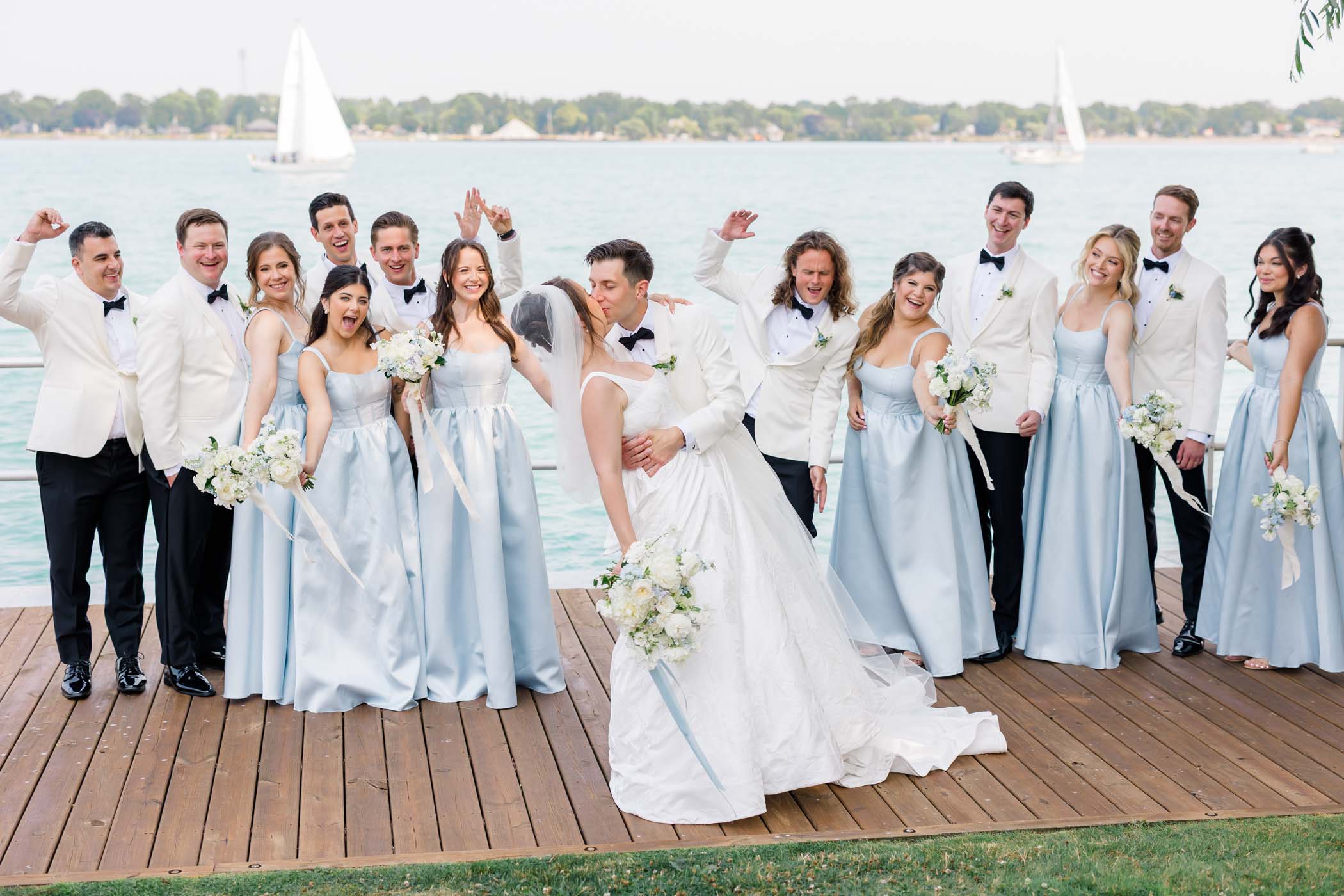 St Clair Michigan wedding with groomsmen in white tuxedos and bridesmaids in pale blue dresses