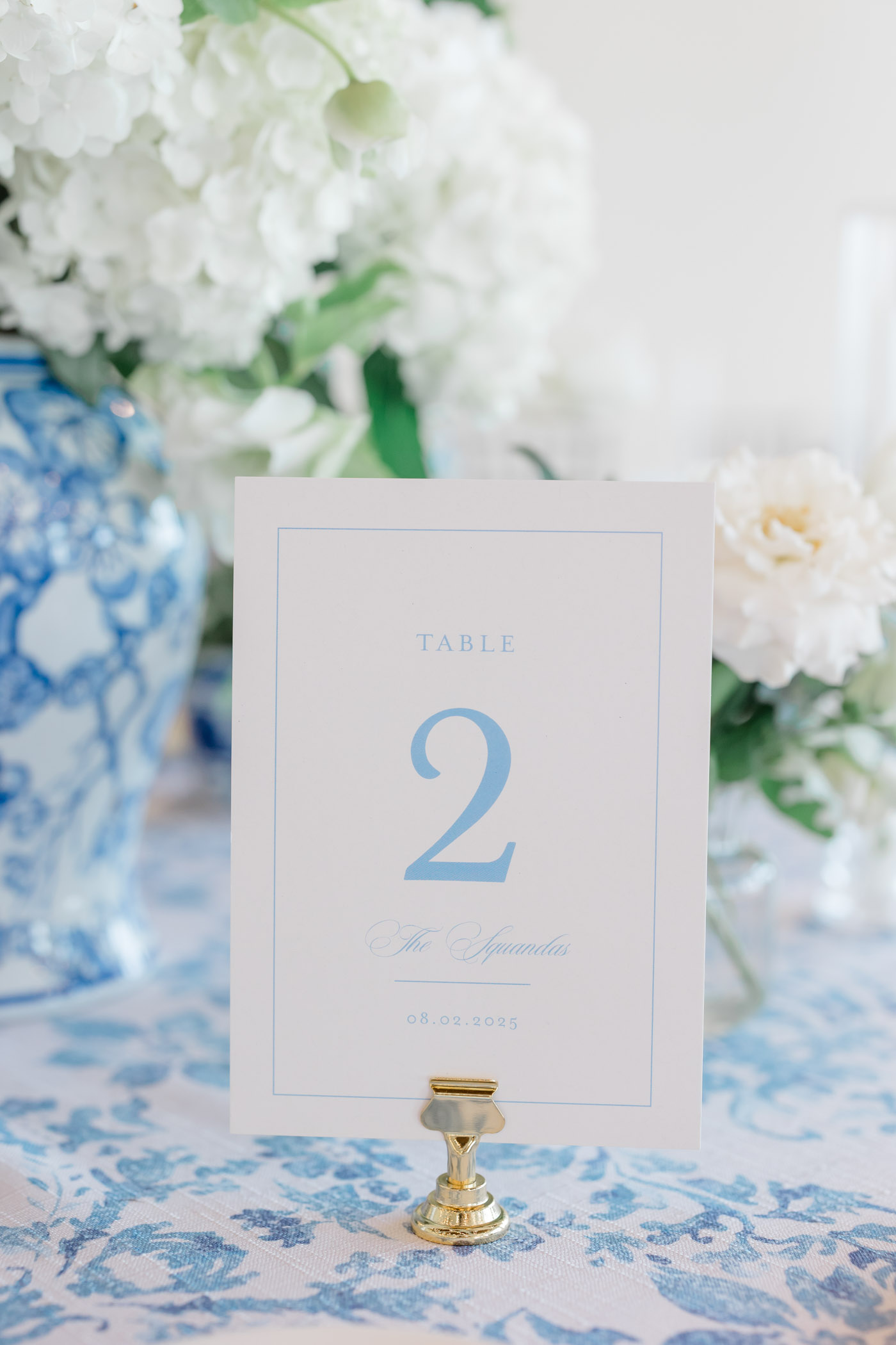 Timeless white and blue paper wedding table number