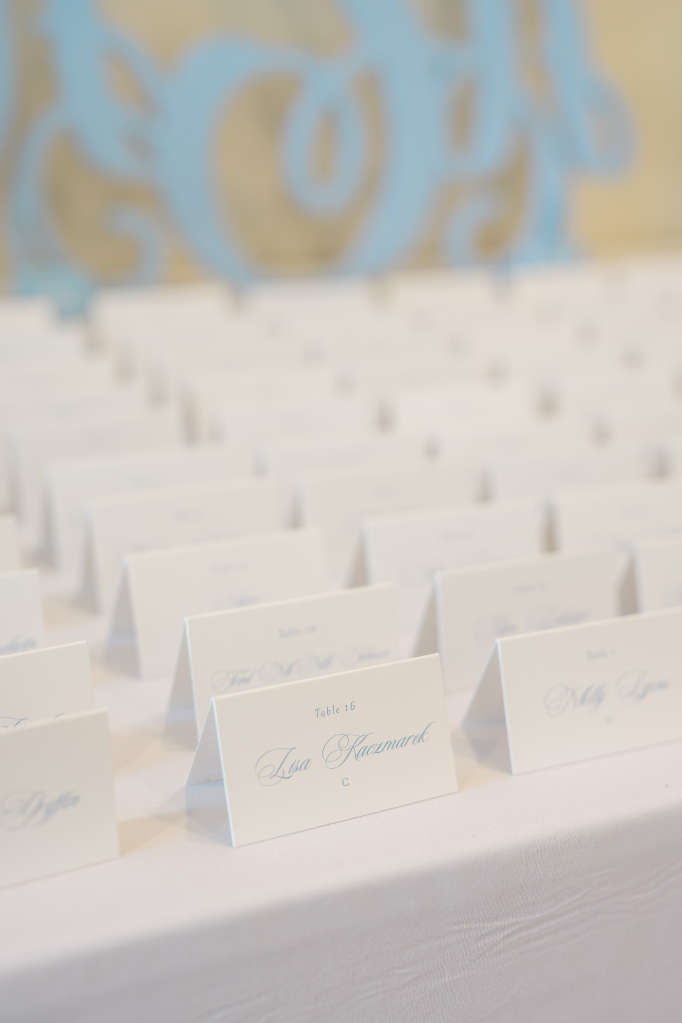 Simple and classic blue and white folded tented wedding escort cards