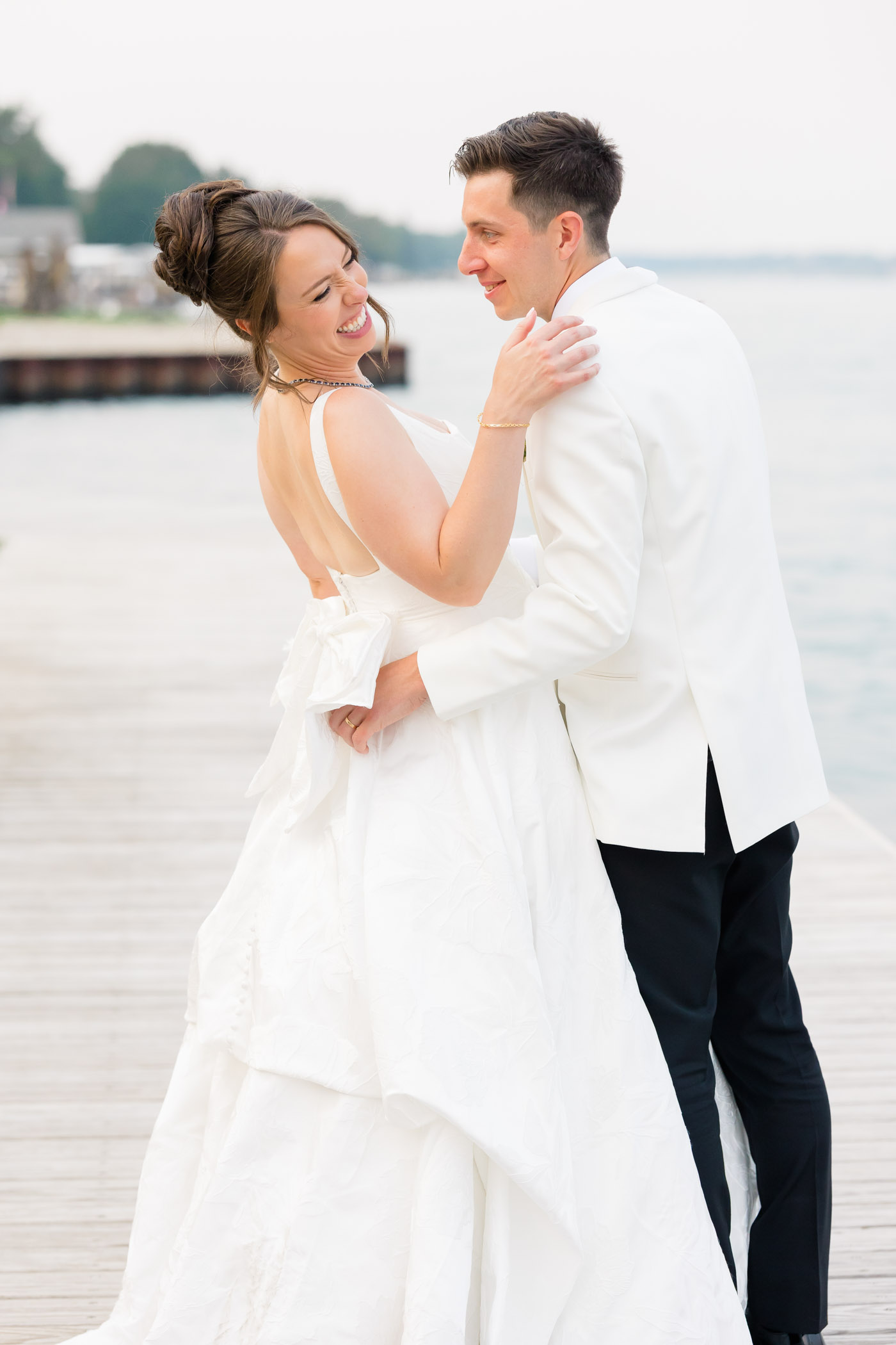 Bride and groom on riverside deck at St Clair Inn in Michigan