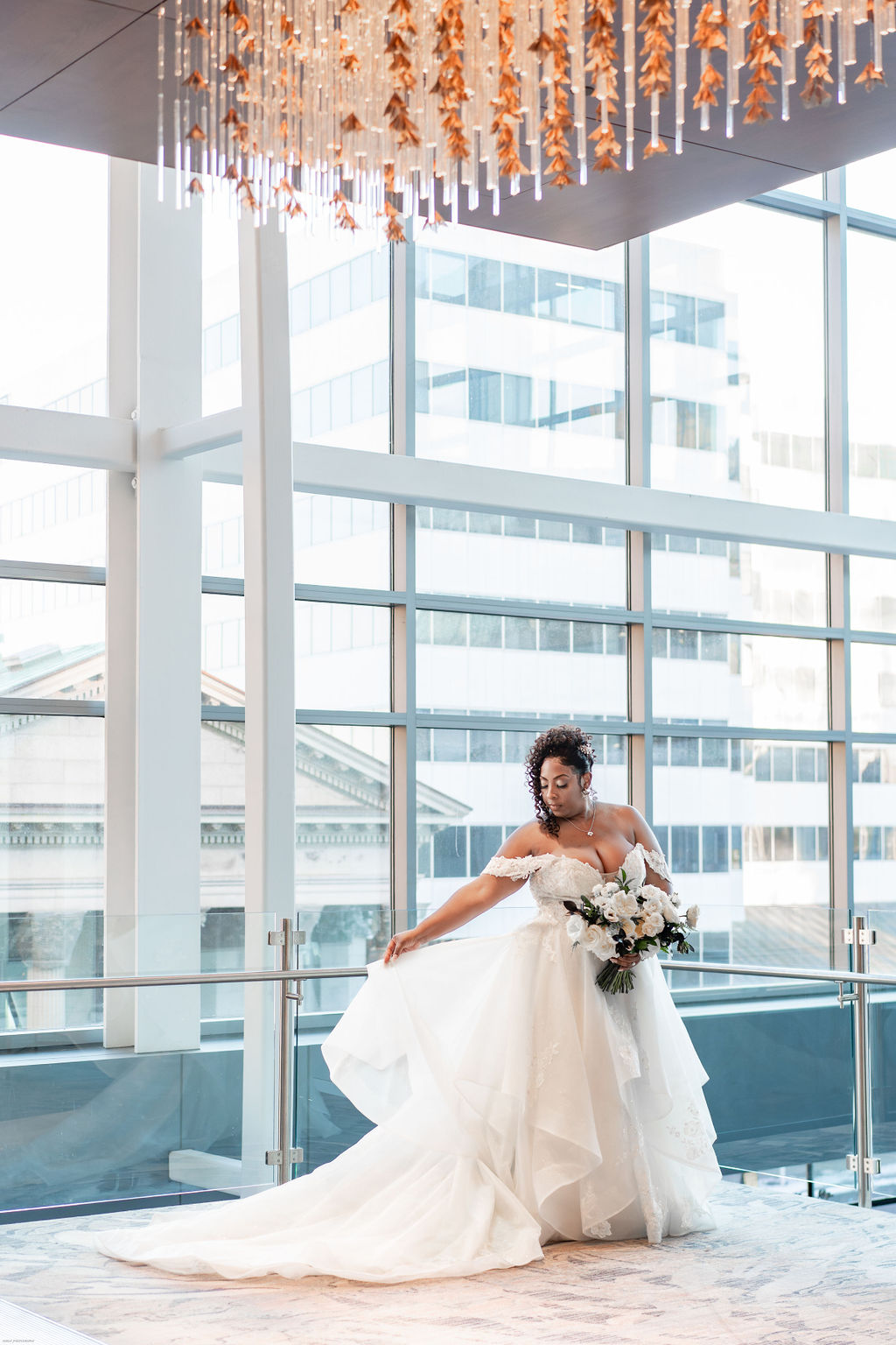 Curvy bride with off the shoulder cascading bridal gown by Fiore Couture