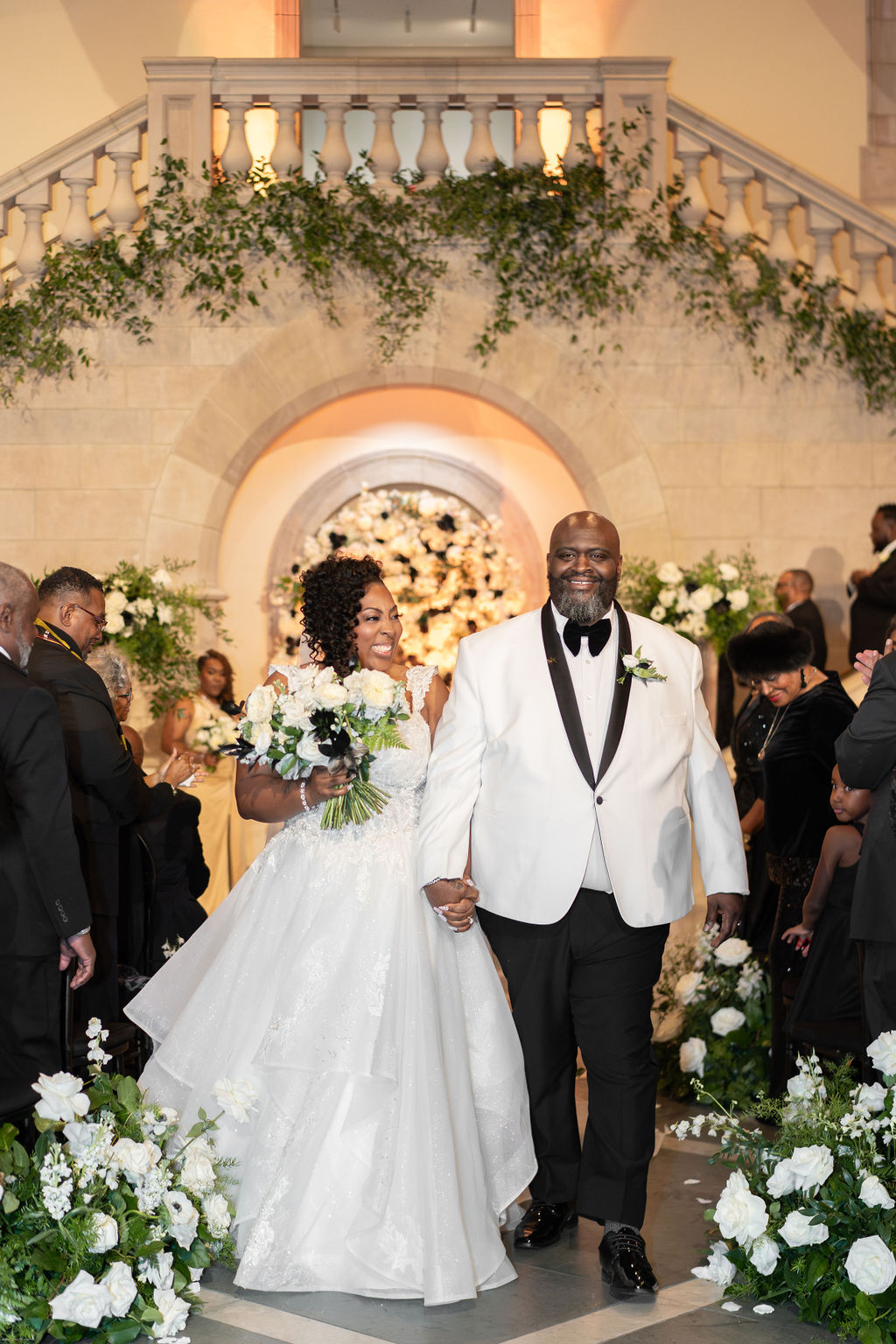 Bride and groom dressed in black and white for their classic wedding at Chrysler Museum of Art in Virginia