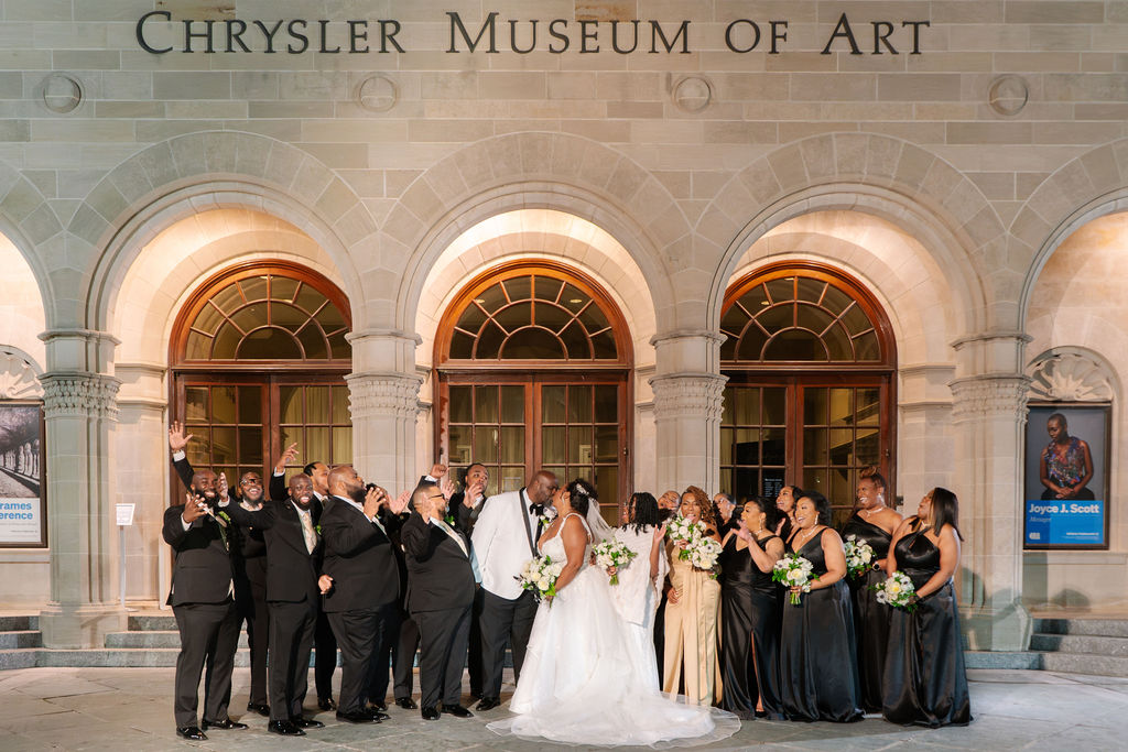 Wedding party celebrating in front of Chrysler Museum of Art in Norfolk Virginia