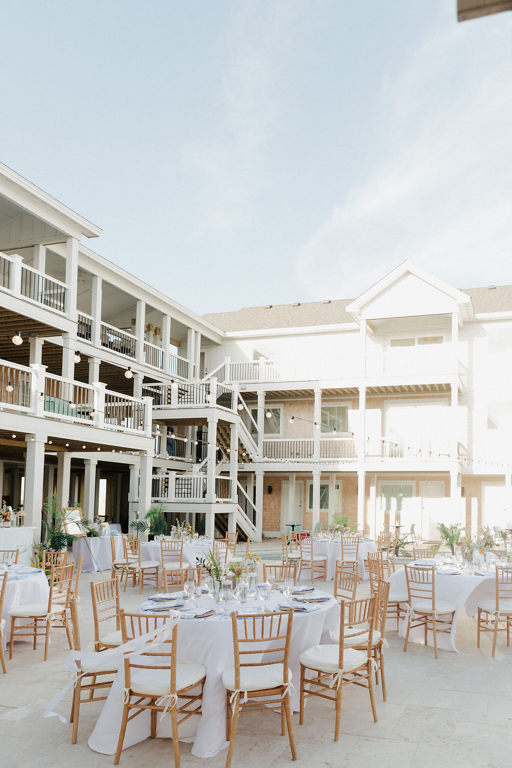 Outdoor patio wedding reception at Hill Runner at Penny's Hill Beach Club