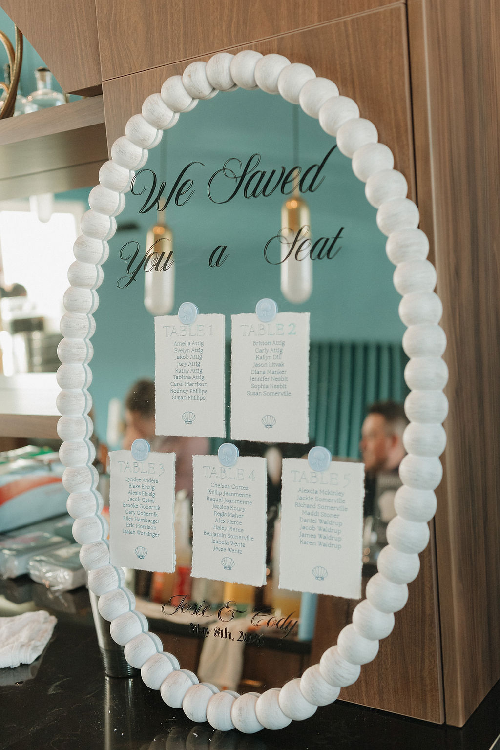 White beaded mirror for beach wedding seating chart personalized with Cricut vinyl and Cricut pens