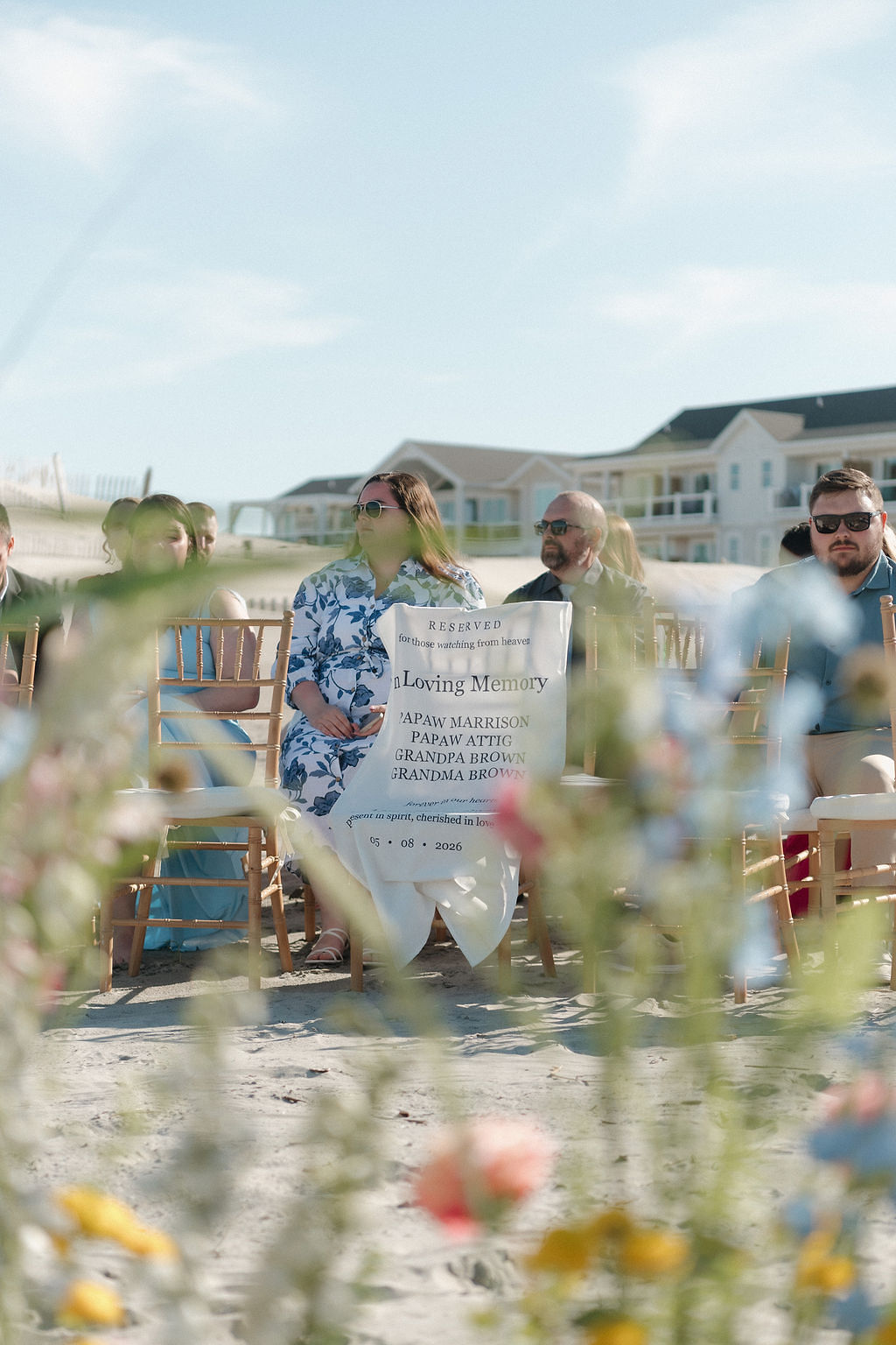 In Loving Memory memorial chair fabric sign made with a Cricut machine for a beach wedding ceremony