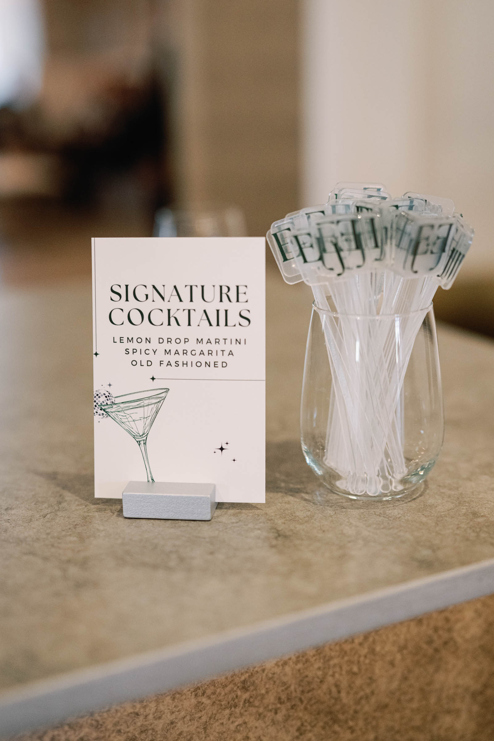 Wedding signature cocktails sign with personalized drink stirrers made with Cricut