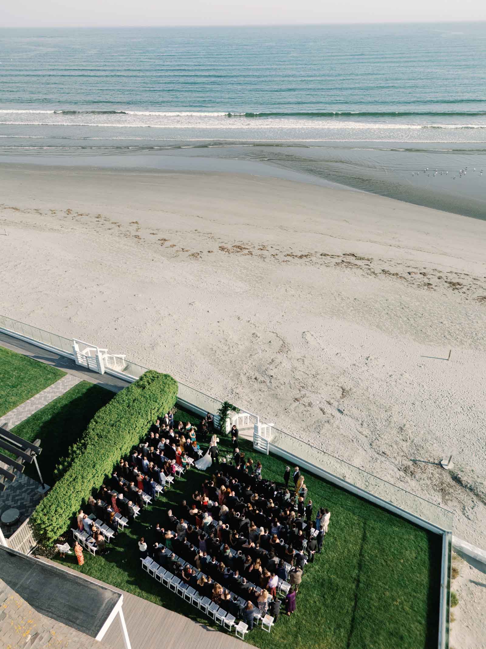 Skyview of oceanside ceremony at Newport Beach House in Newport Rhode Island