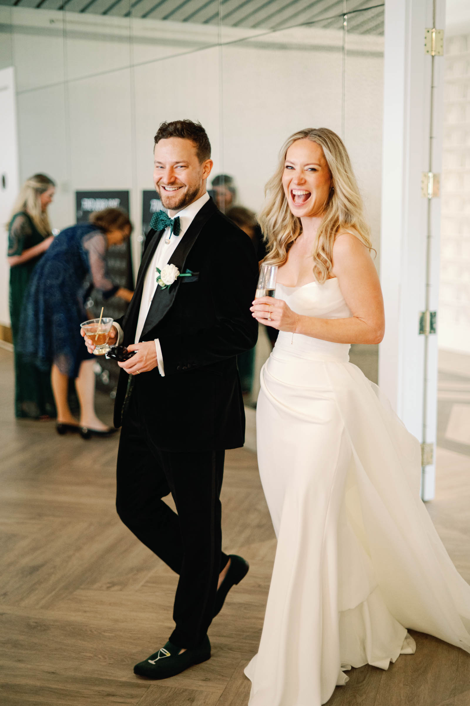 Bride wearing chic chiffon detachable overskirt with her modern wedding dres