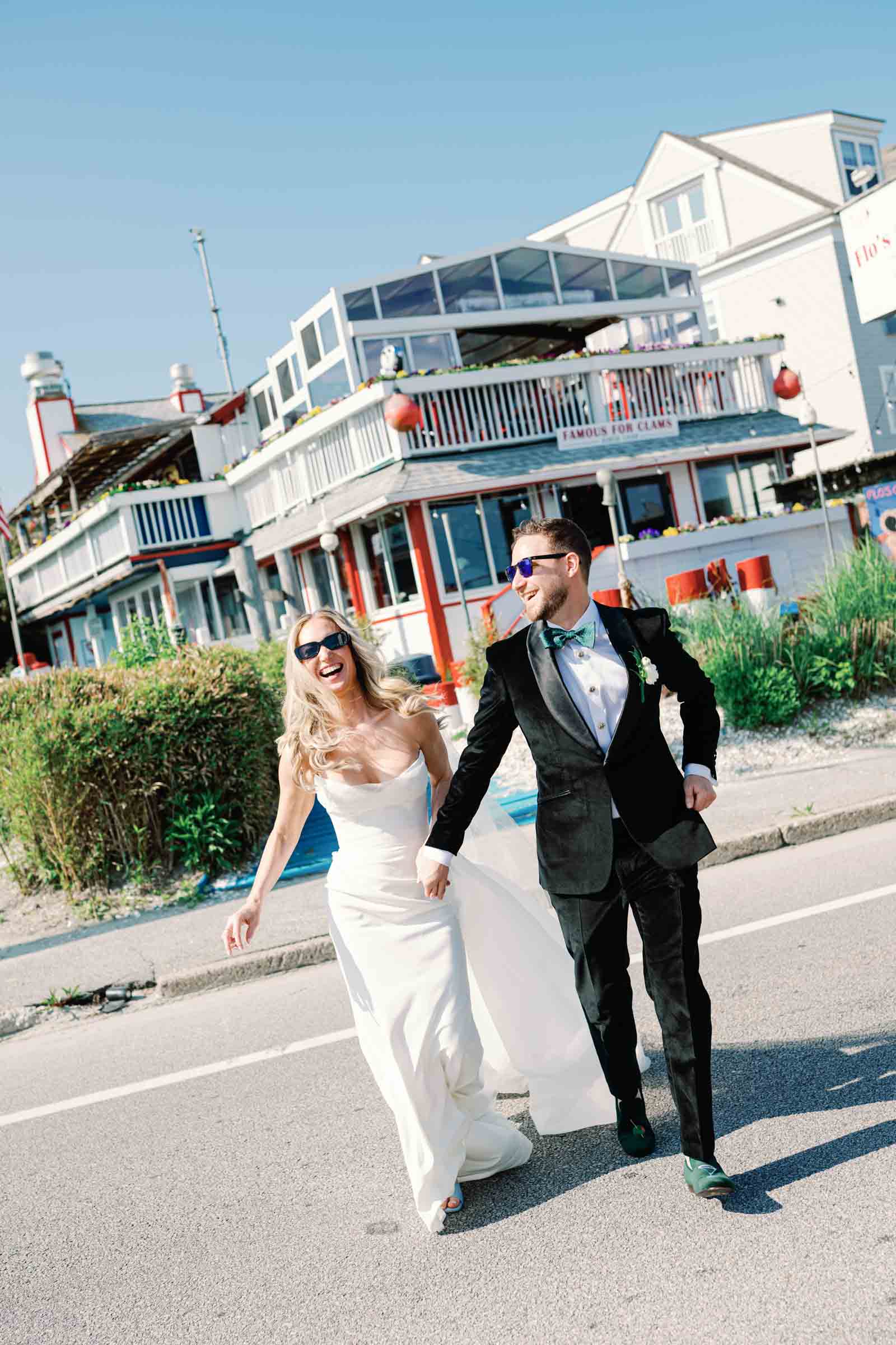 Iconic Newport Beach bride and groom with lobster rolls at Flos Clam Shack