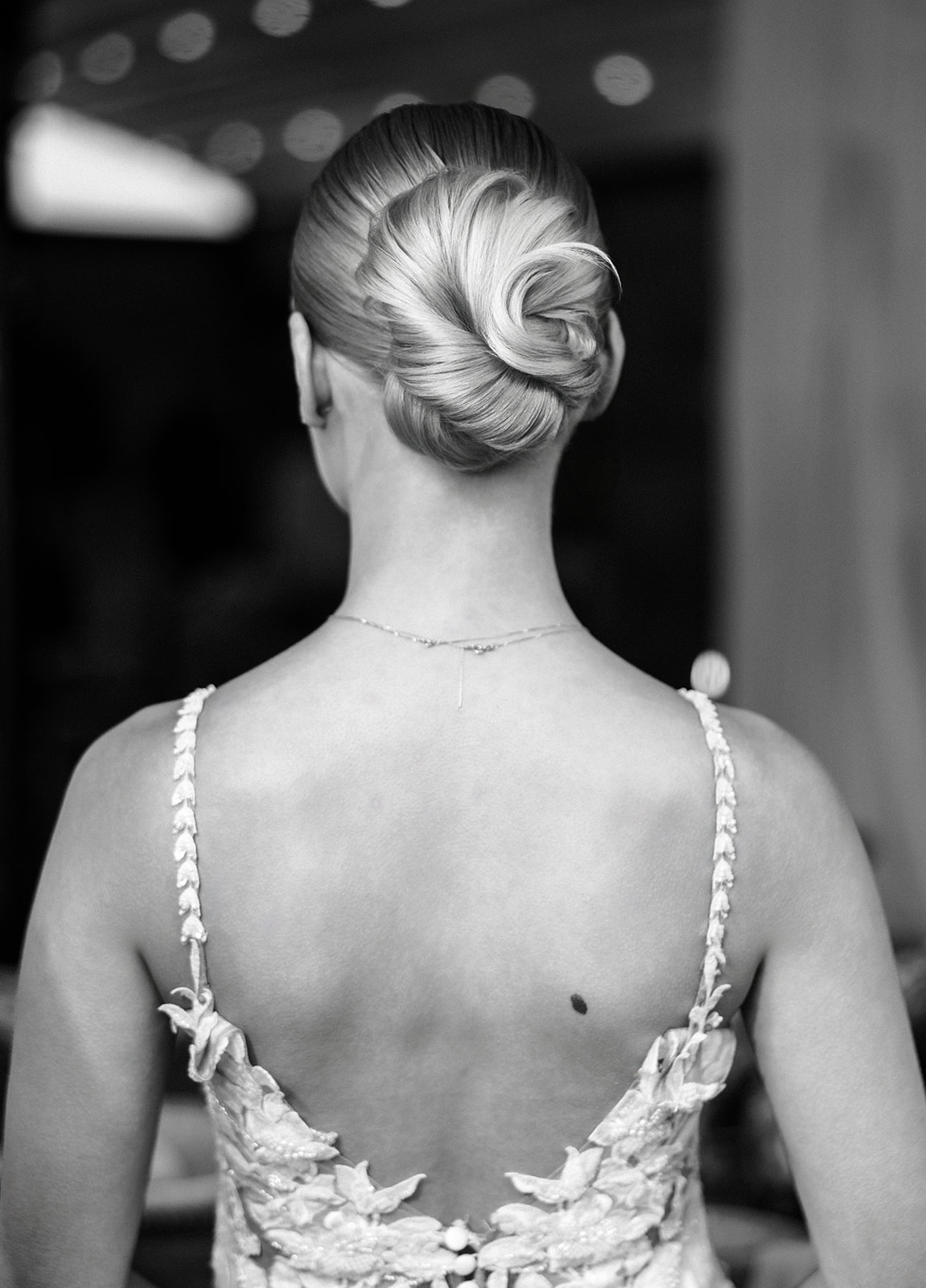 Chic swirled chignon updo for sophisticated bridal hair