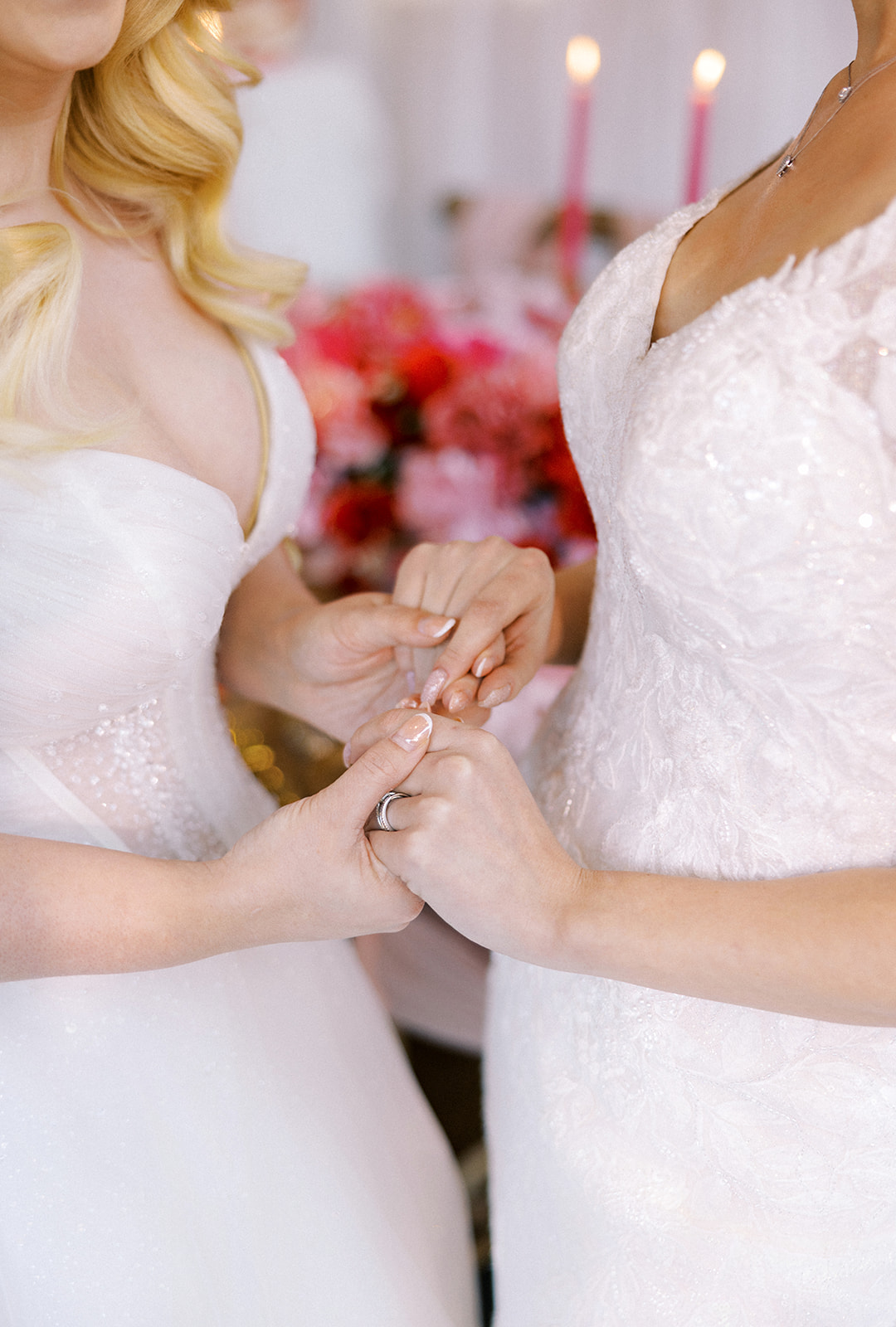 Two brides holding hands with french manicure