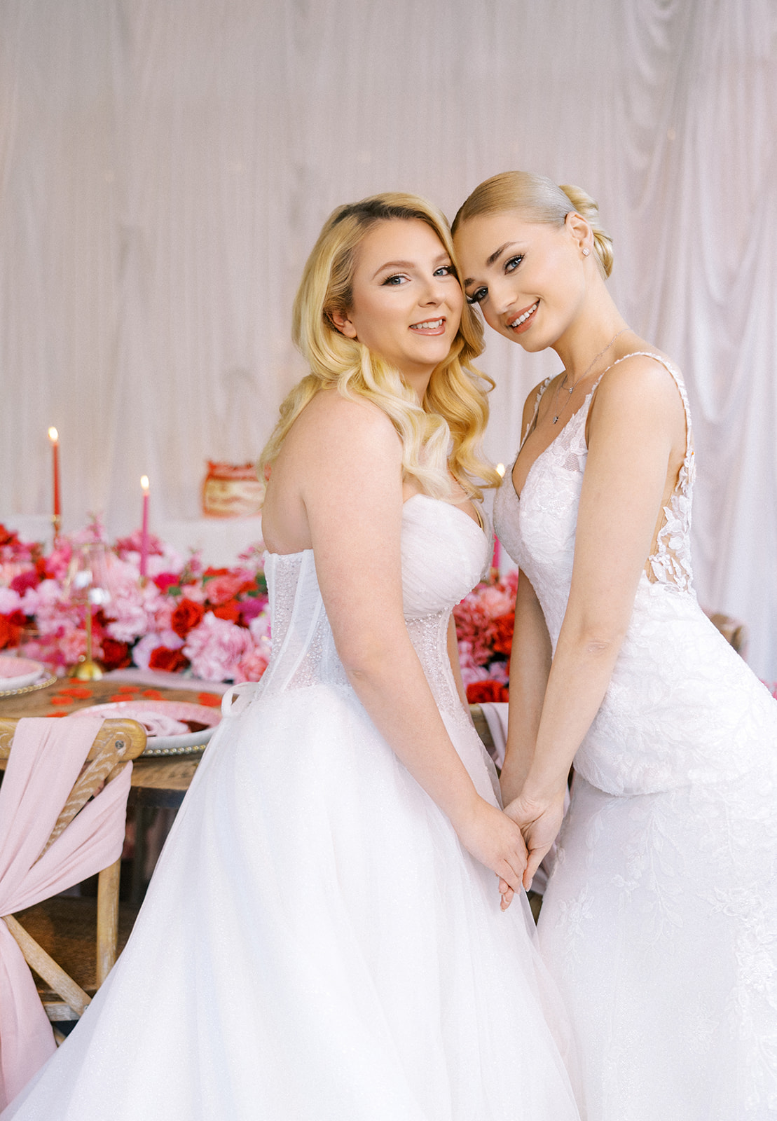 Two brides with fresh soft glam makeup for red and pink wedding