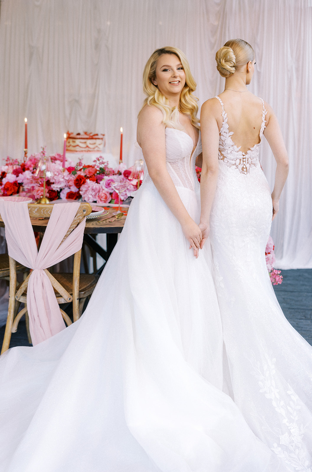 Two brides wearing long wedding dresses with two different style