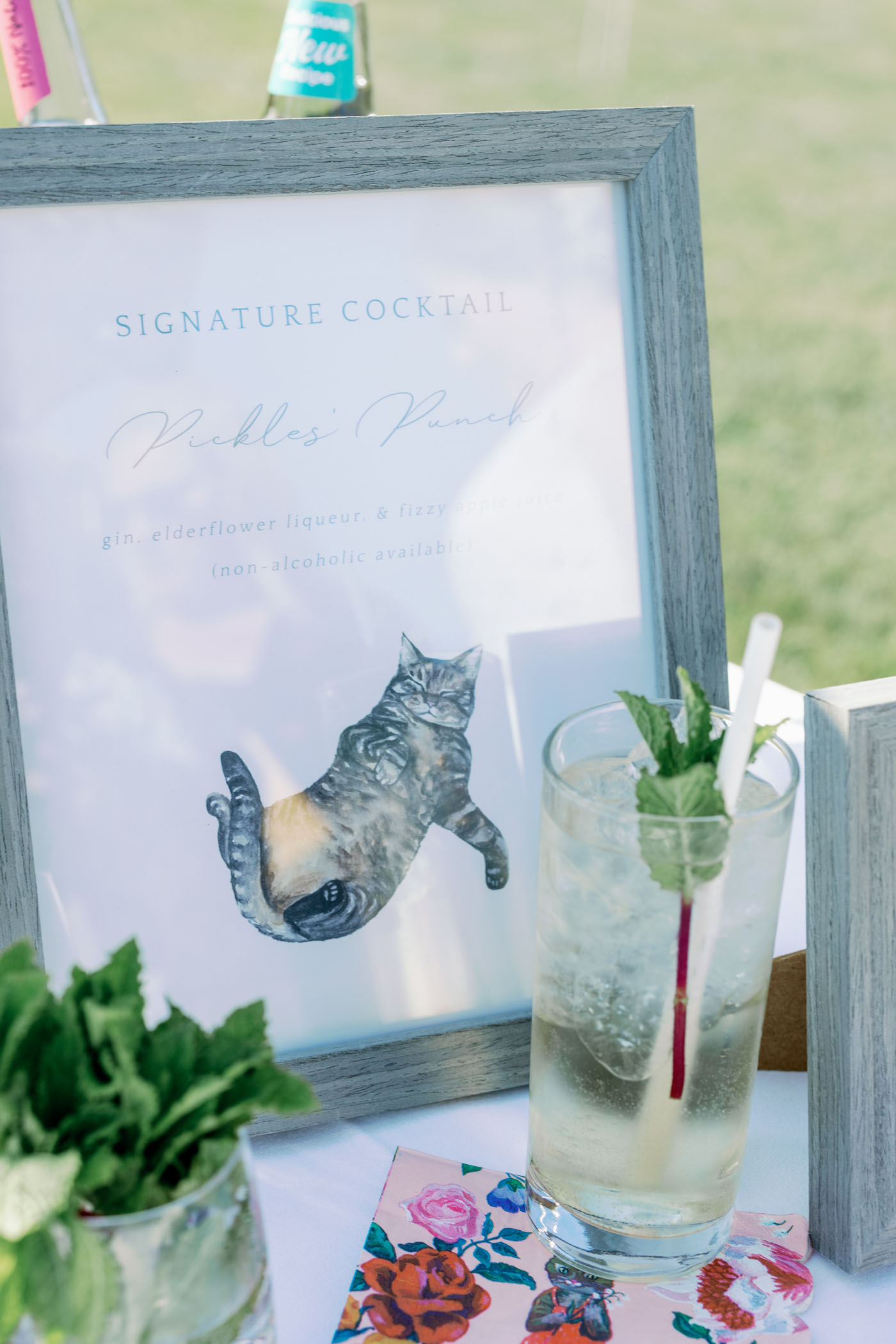 Signature cocktail sign featuring couples cat