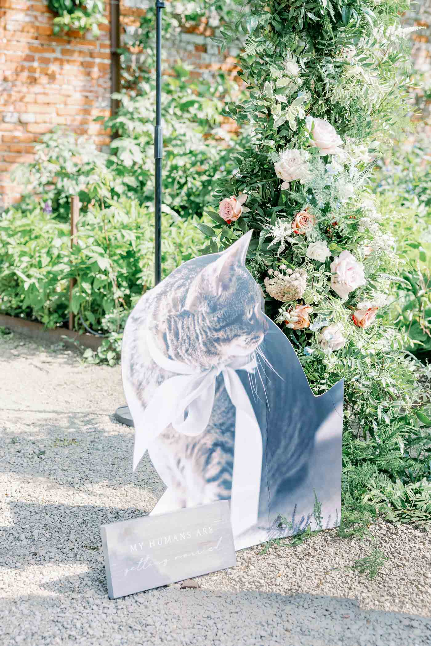 Giant cardboard cat cutout for garden wedding ceremony