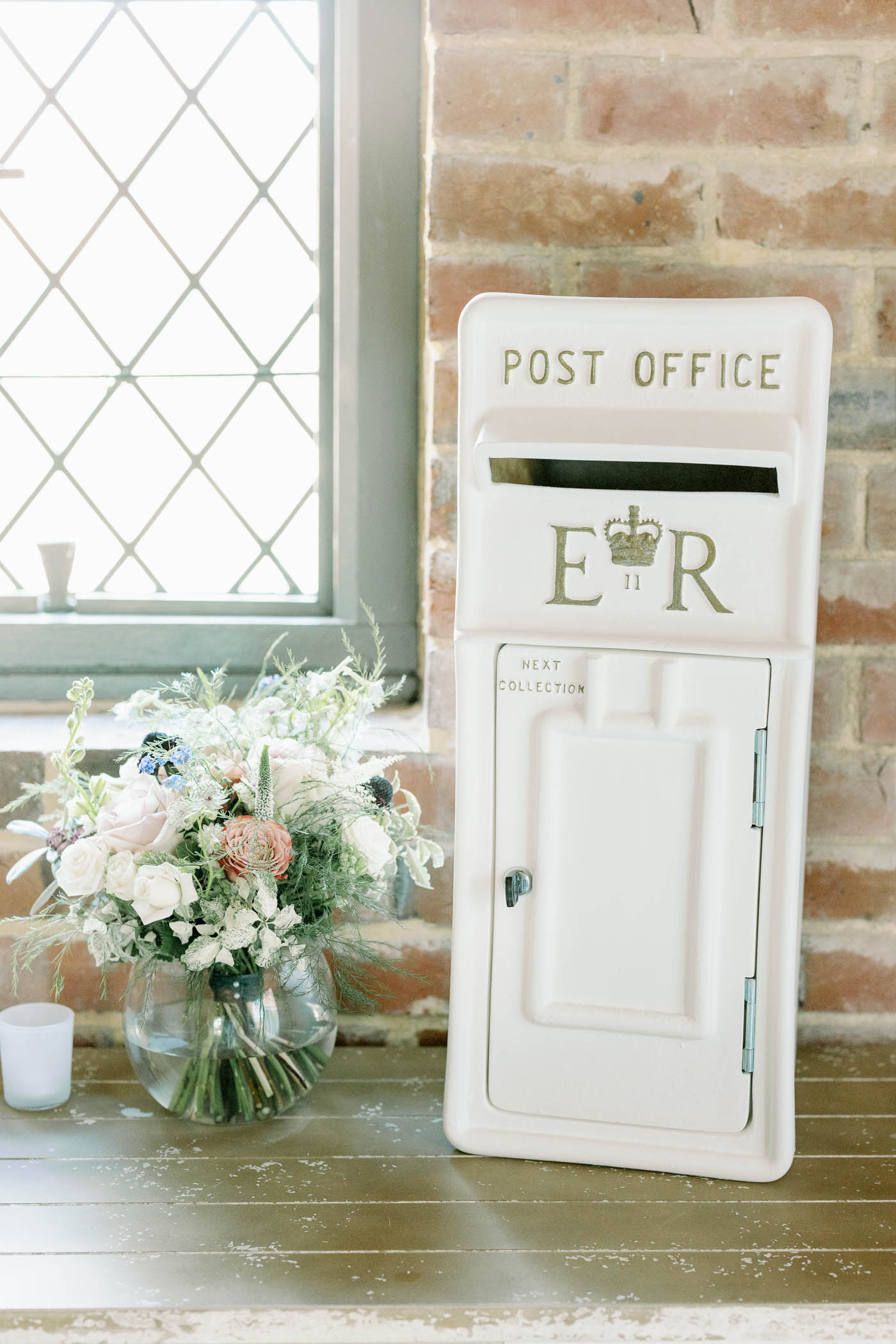 Alternative wedding guestbook in the form of a white British postbox