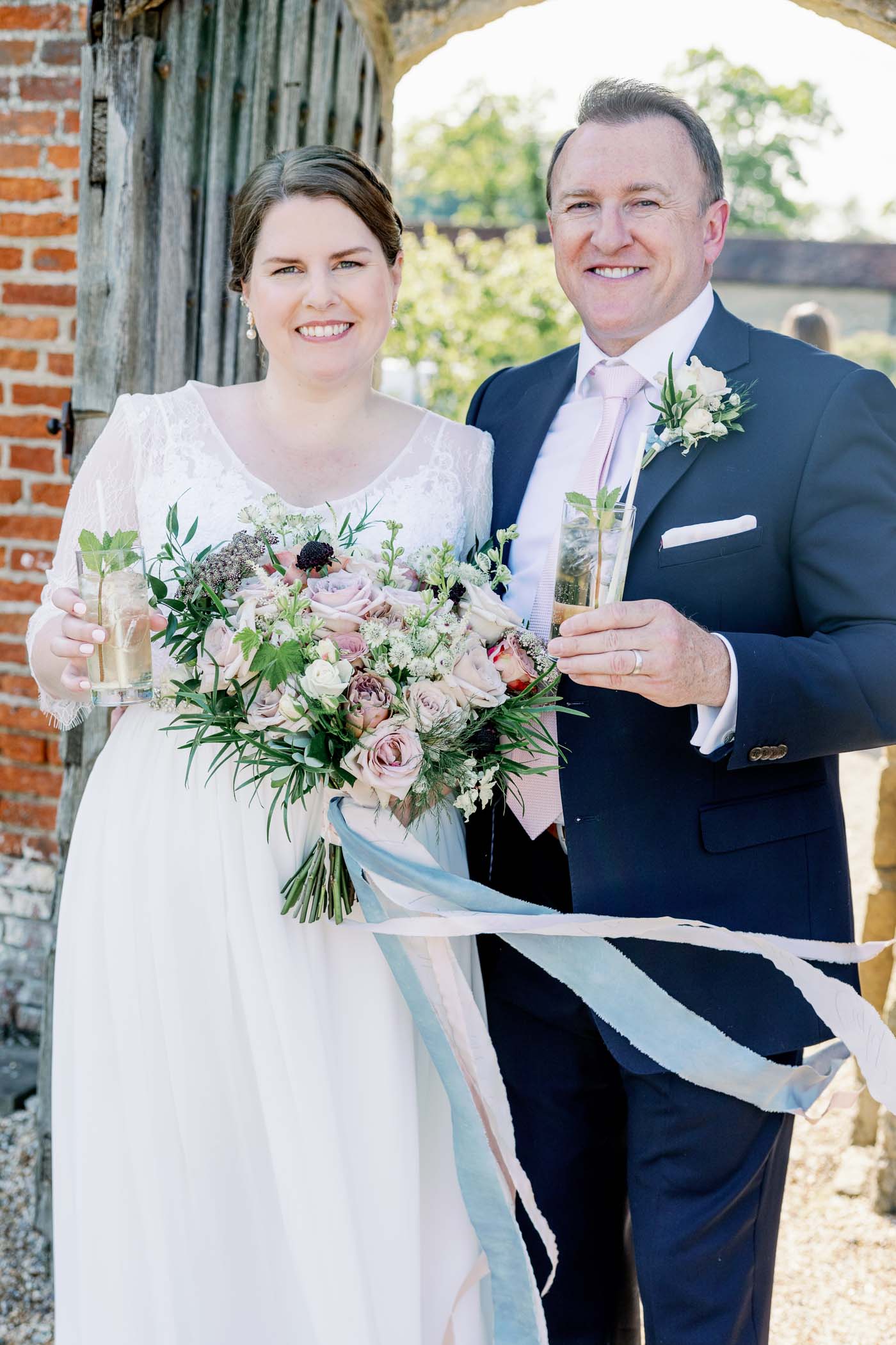 Bride and groom cutting the cake at Walled Garden at Cowdray Estate